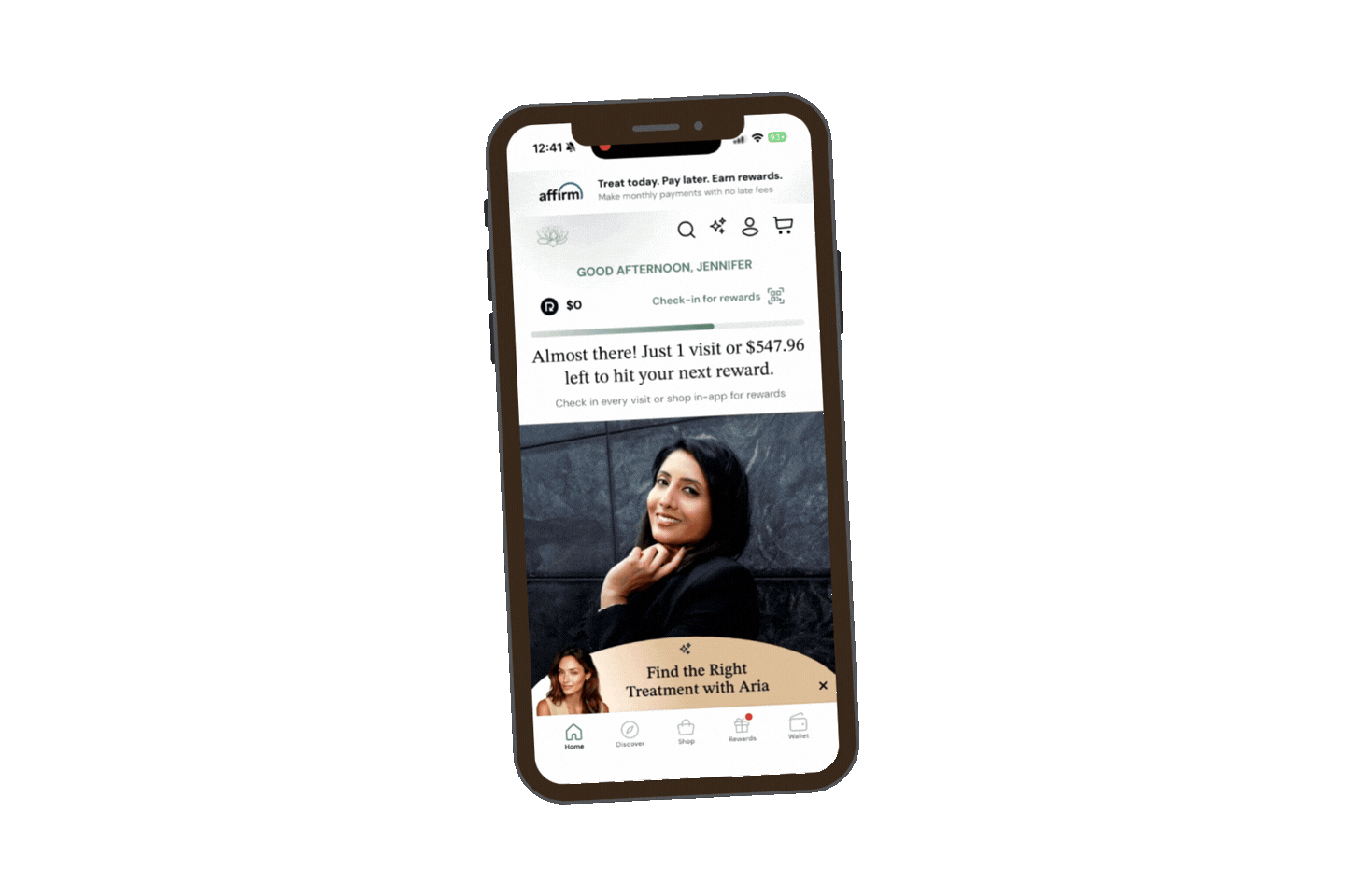 Smartphone screen displaying a rewards app interface with a photo of a smiling woman in a black top against a dark background, and text about reaching a reward milestone.