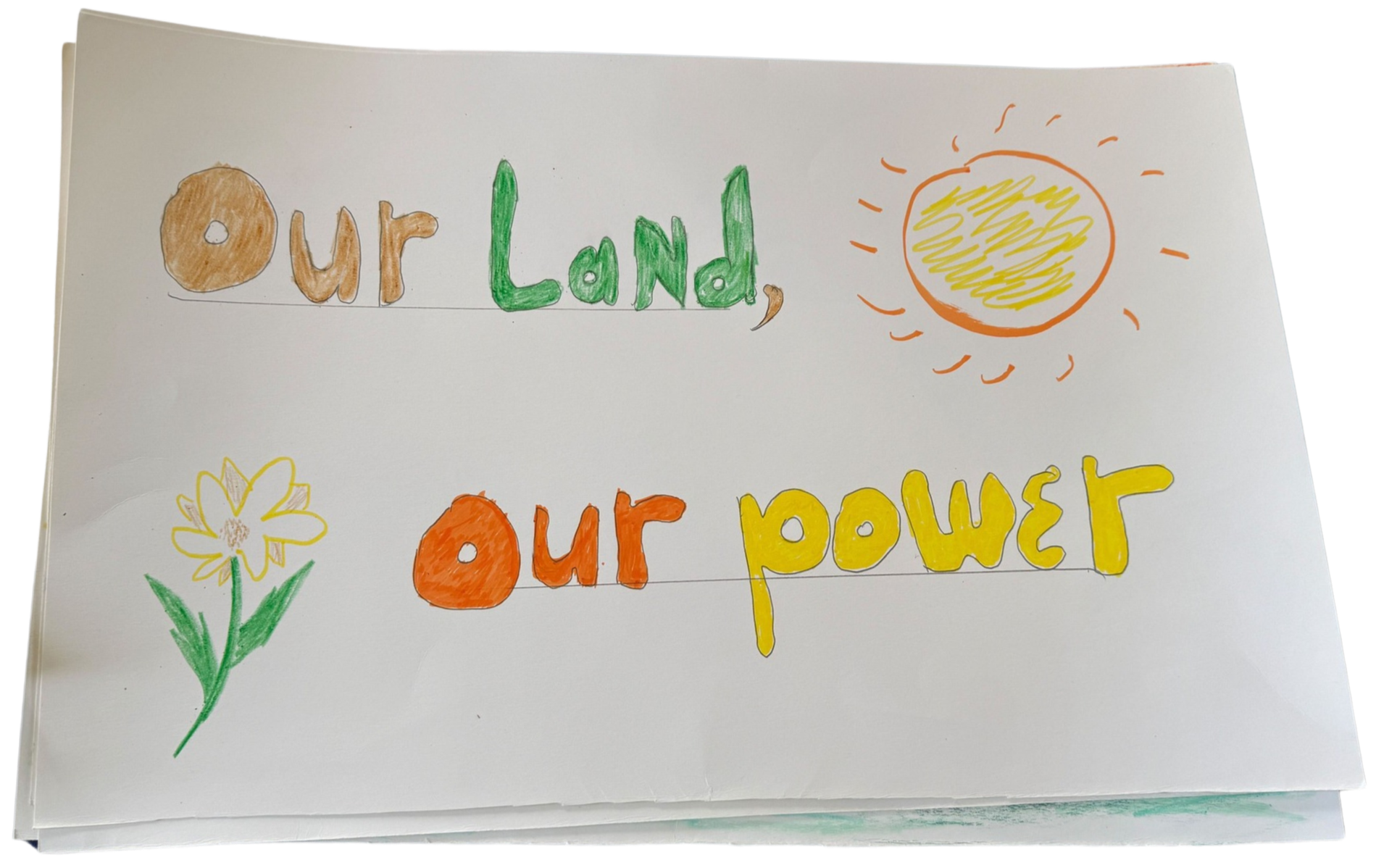 Colorful handwritten sign on white paper that says "Our Land, our power" with small drawings of a flower and a sun.