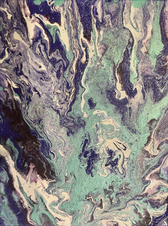 Close-up of an abstract, colorful, swirling pattern with shades of green, purple, black, and white.