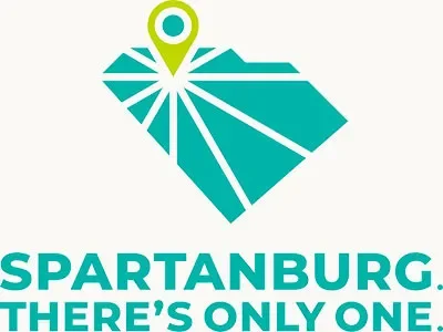 A stylized map of South Carolina with a pinpoint marker on Spartanburg, accompanied by the text 'SPARTANBURG. THERE'S ONLY ONE' in bold teal letters.