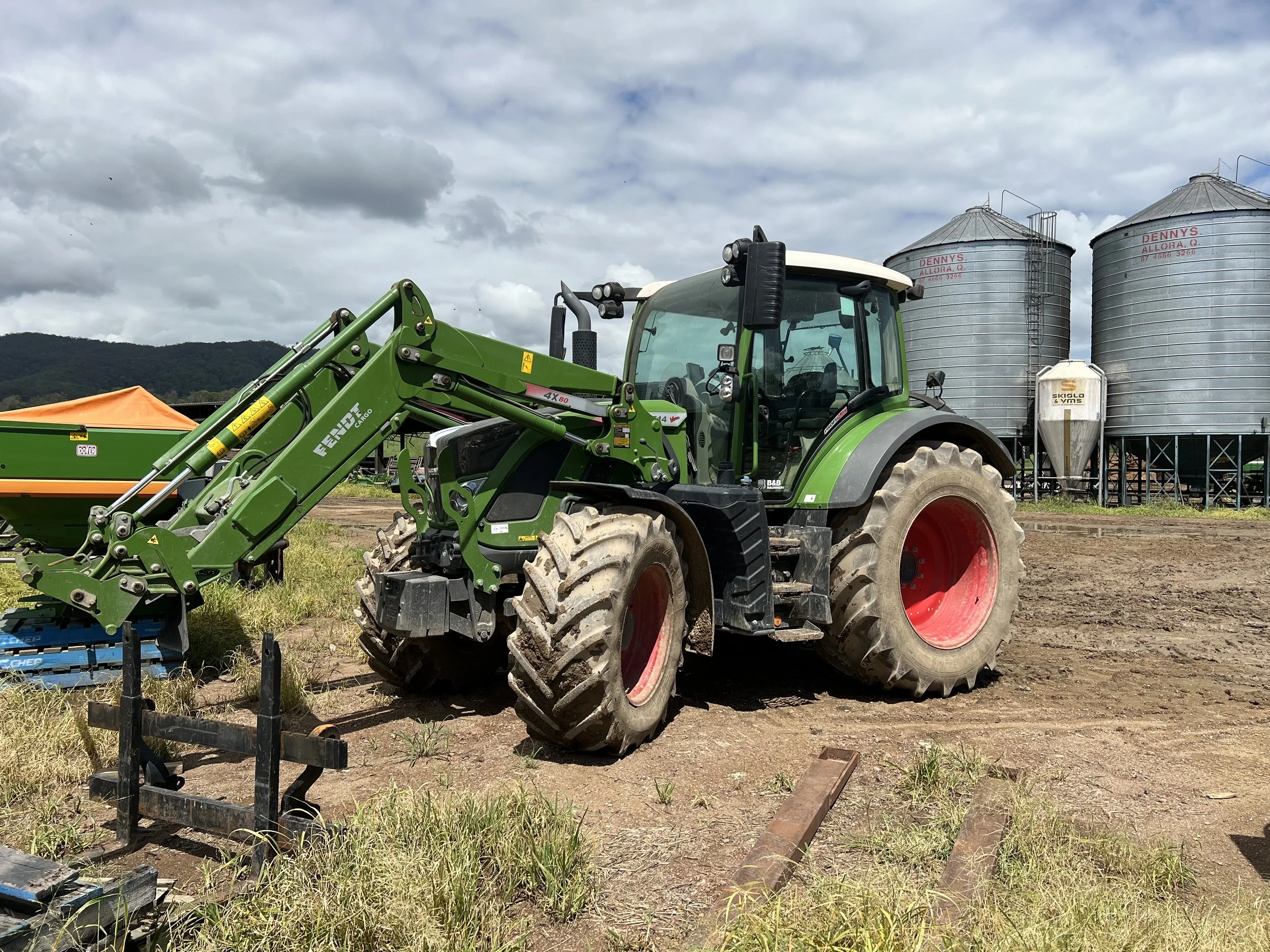 A green tractor with large wheels and a front loader repairs and maintenance by Bambrick Mechanical