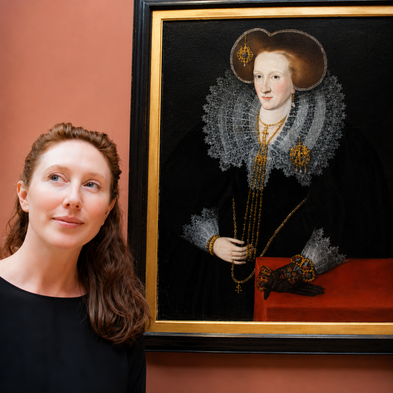 Author Krysta Abesamis, female with long red hair wearing black standing next to a portrait of her ancestor Agnes Douglas, Countess of Argyle hanging in the National Galleries of Scotland collection.