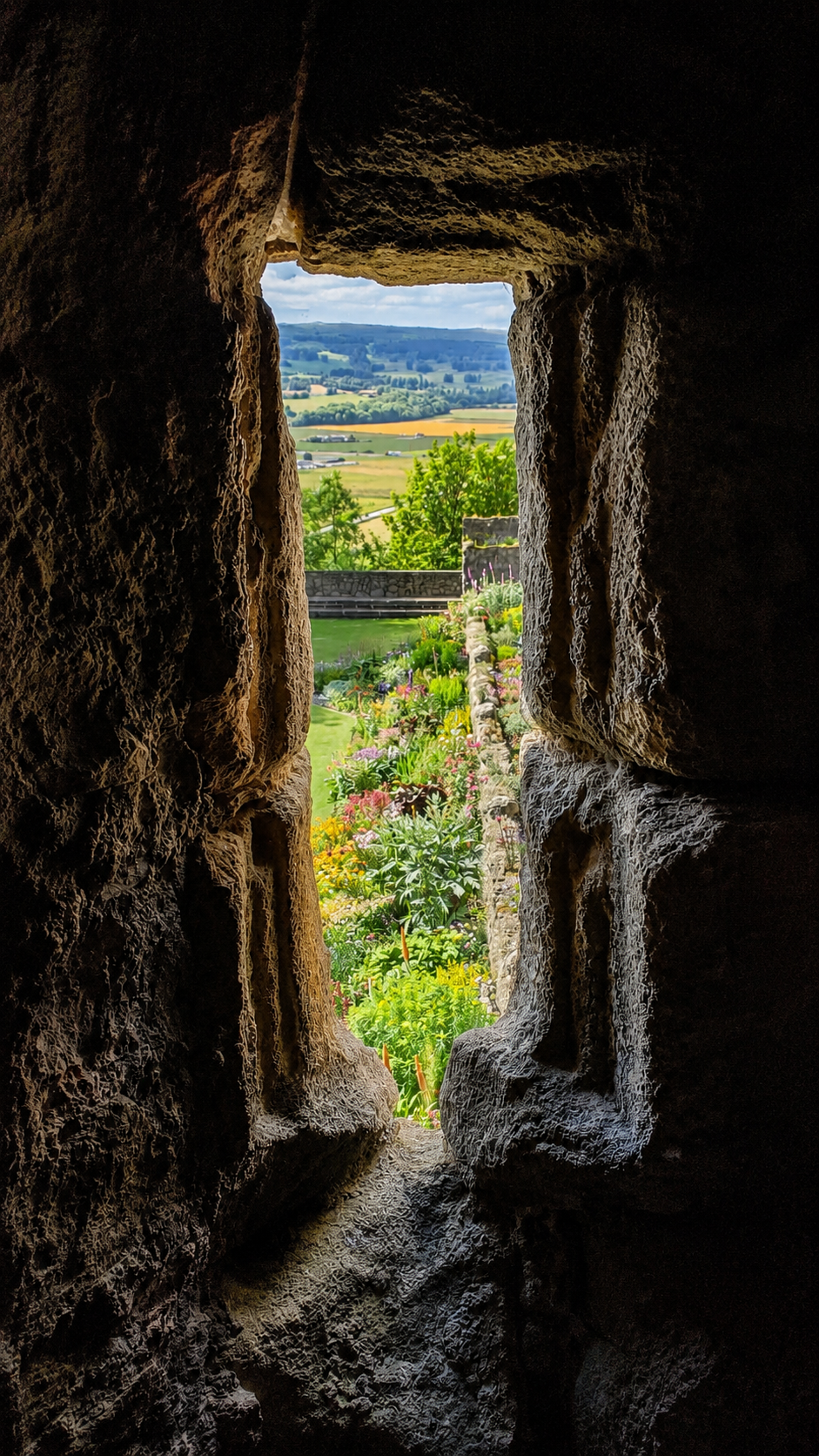 View from a narrow stone castle window.