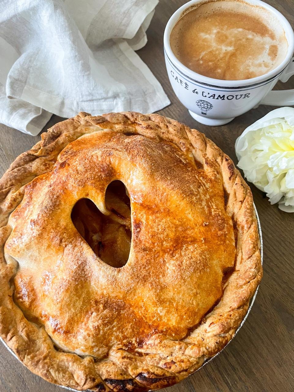 Julian apple pie styled at home with coffee and white peony