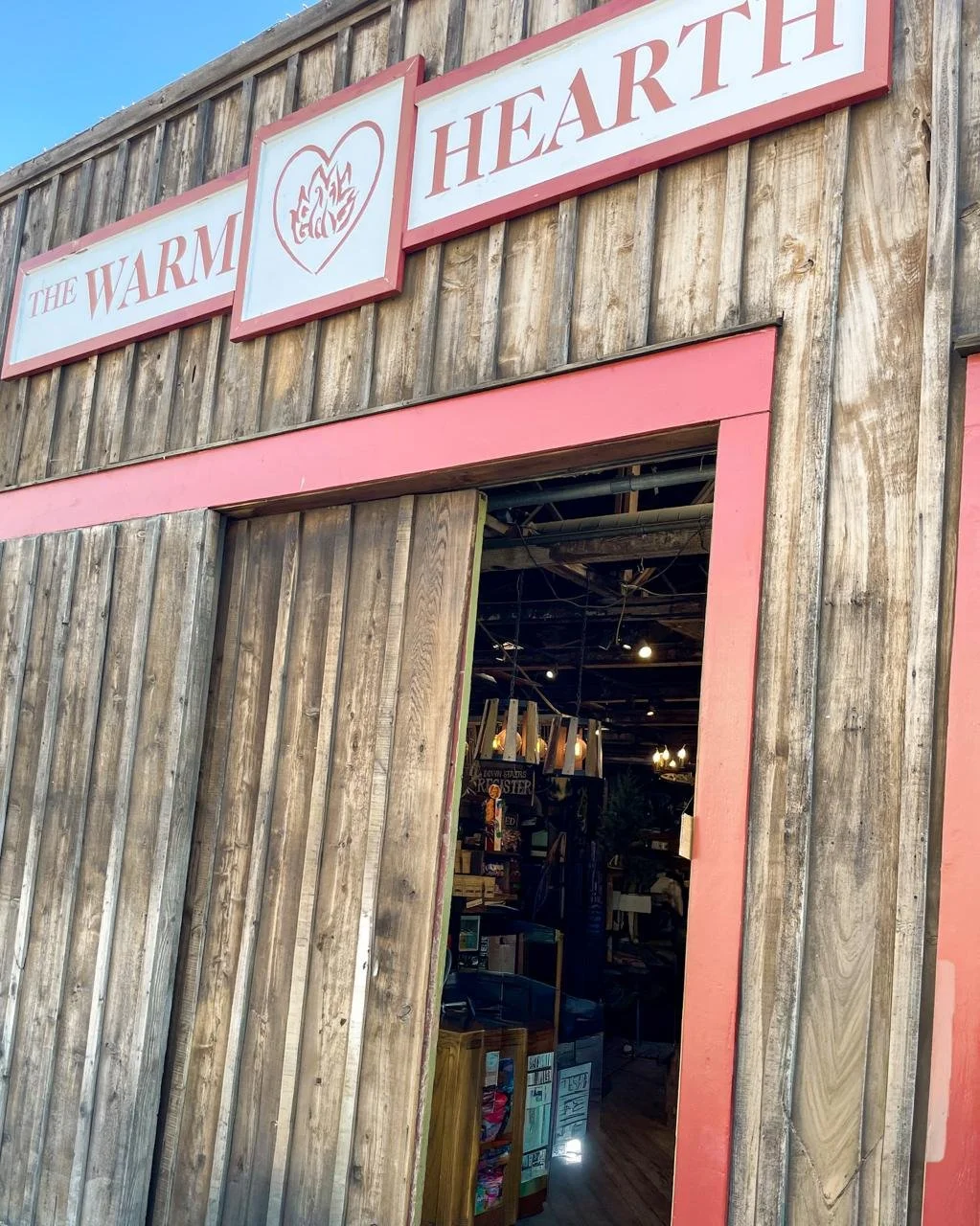 The Warm Hearth store exterior in Julian California with rustic wood facade and red trim