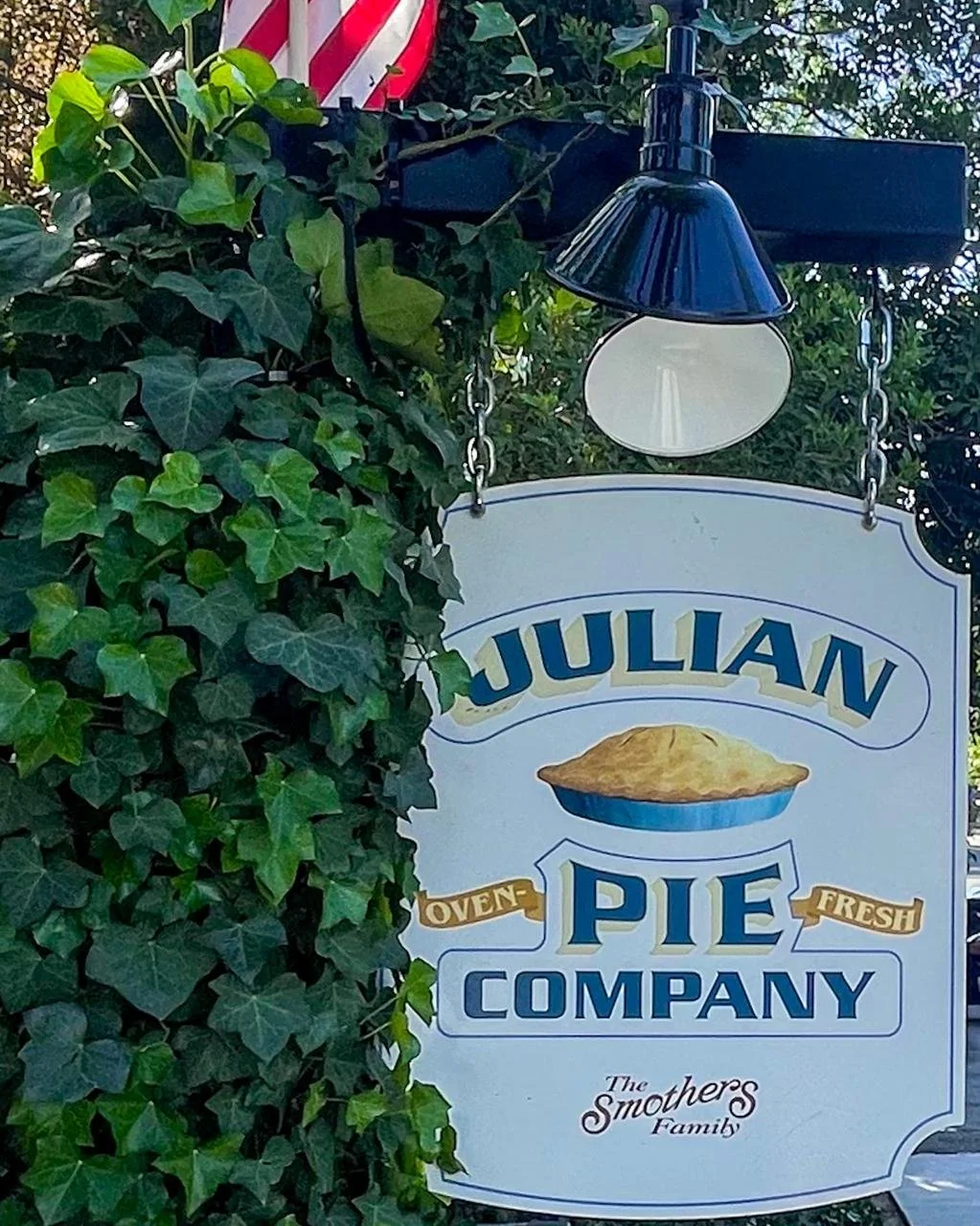 Julian Pie Company sign surrounded by ivy in Julian California