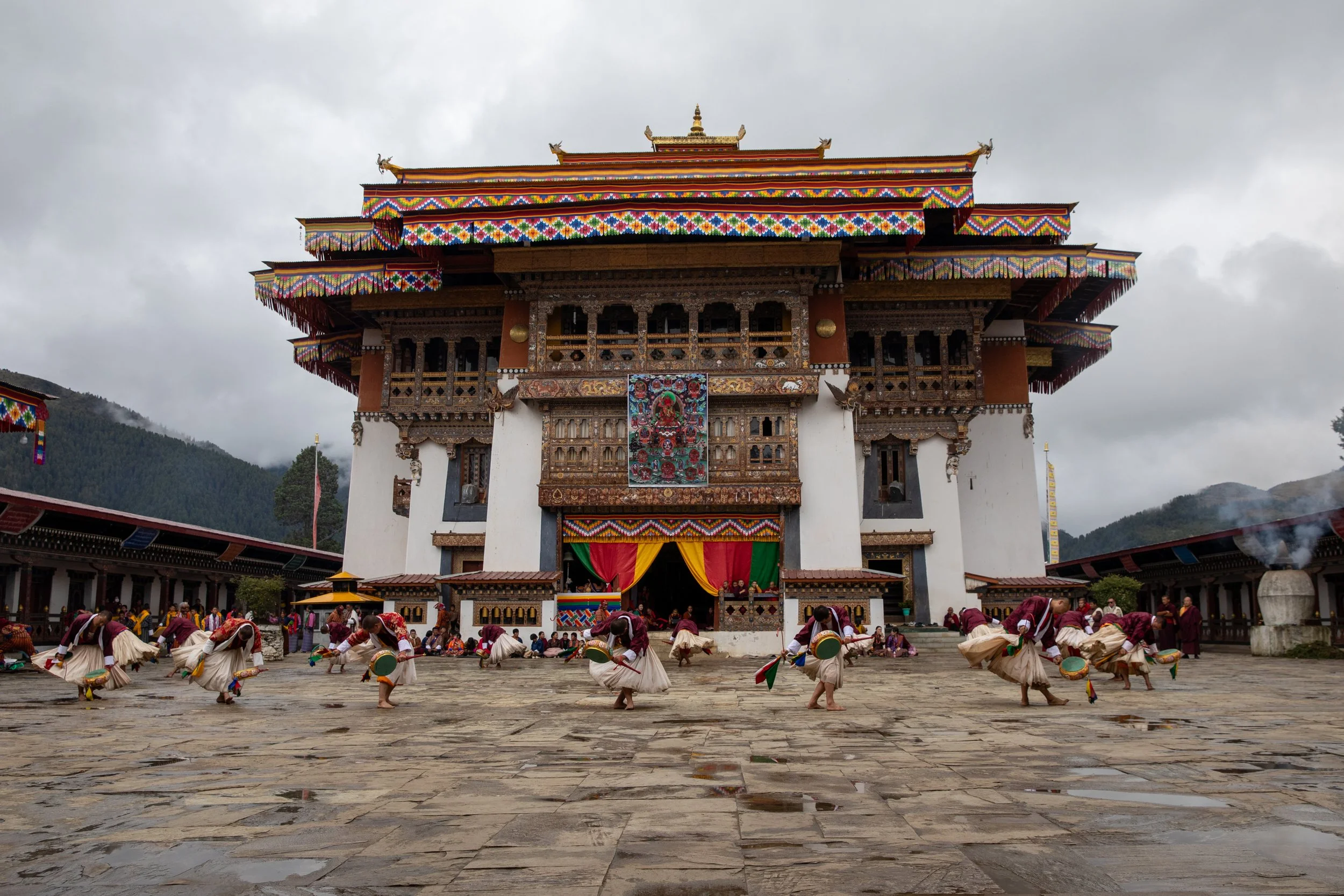 Gangtey Monastery pre festival celebrations in Bhutan. Men dancing and preparing for the weekends activites