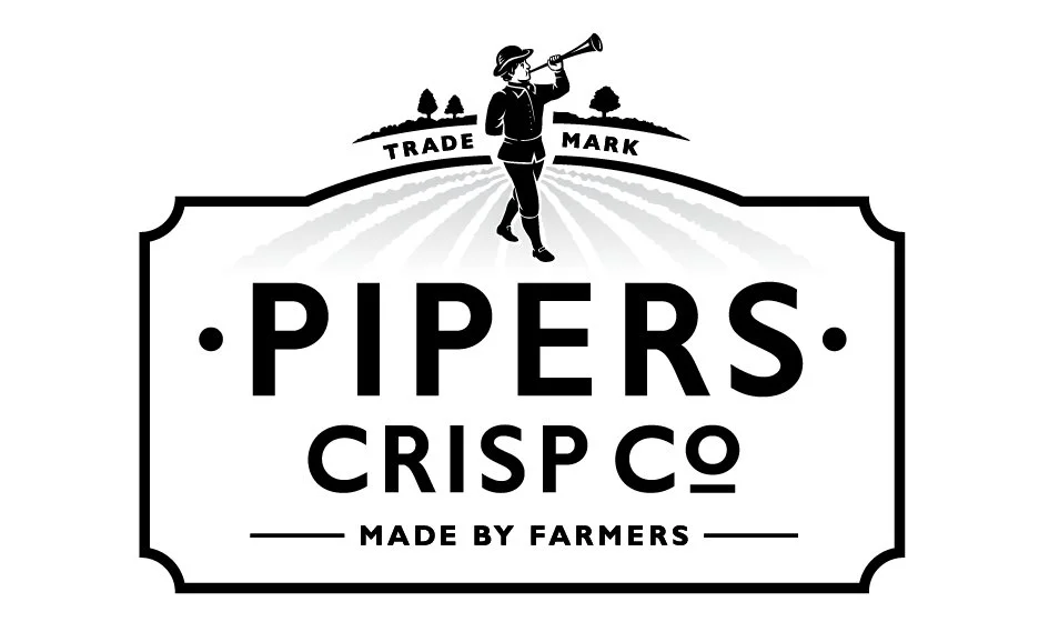 Logo for Pipers Crisp Co featuring a person with a hat playing a trumpet on a farm landscape with trees, with the text 'Trade Mark' above and 'Made by Farmers' below.