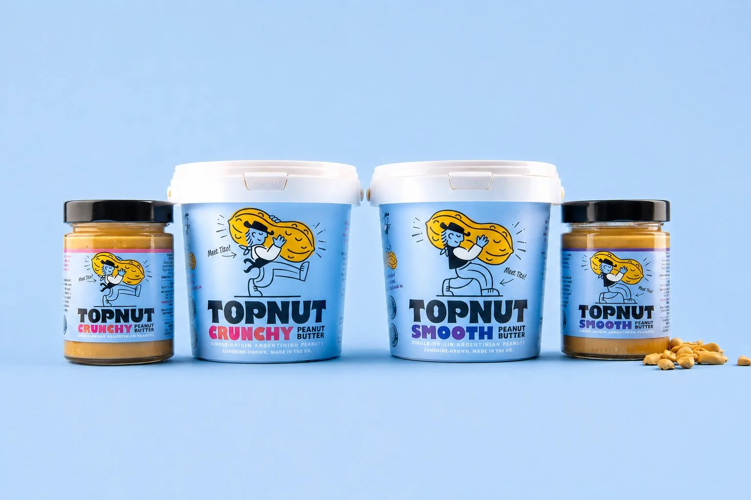 Two jars of peanut butter and two jars of crunchy peanut butter, with two large containers of peanut butter in the background on a blue surface and background.