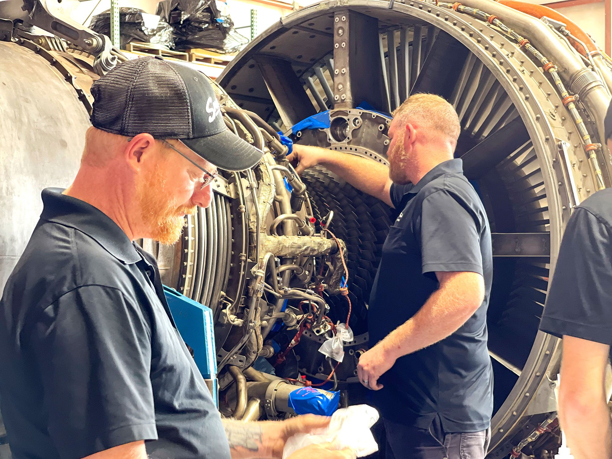 mechanics woking on engine