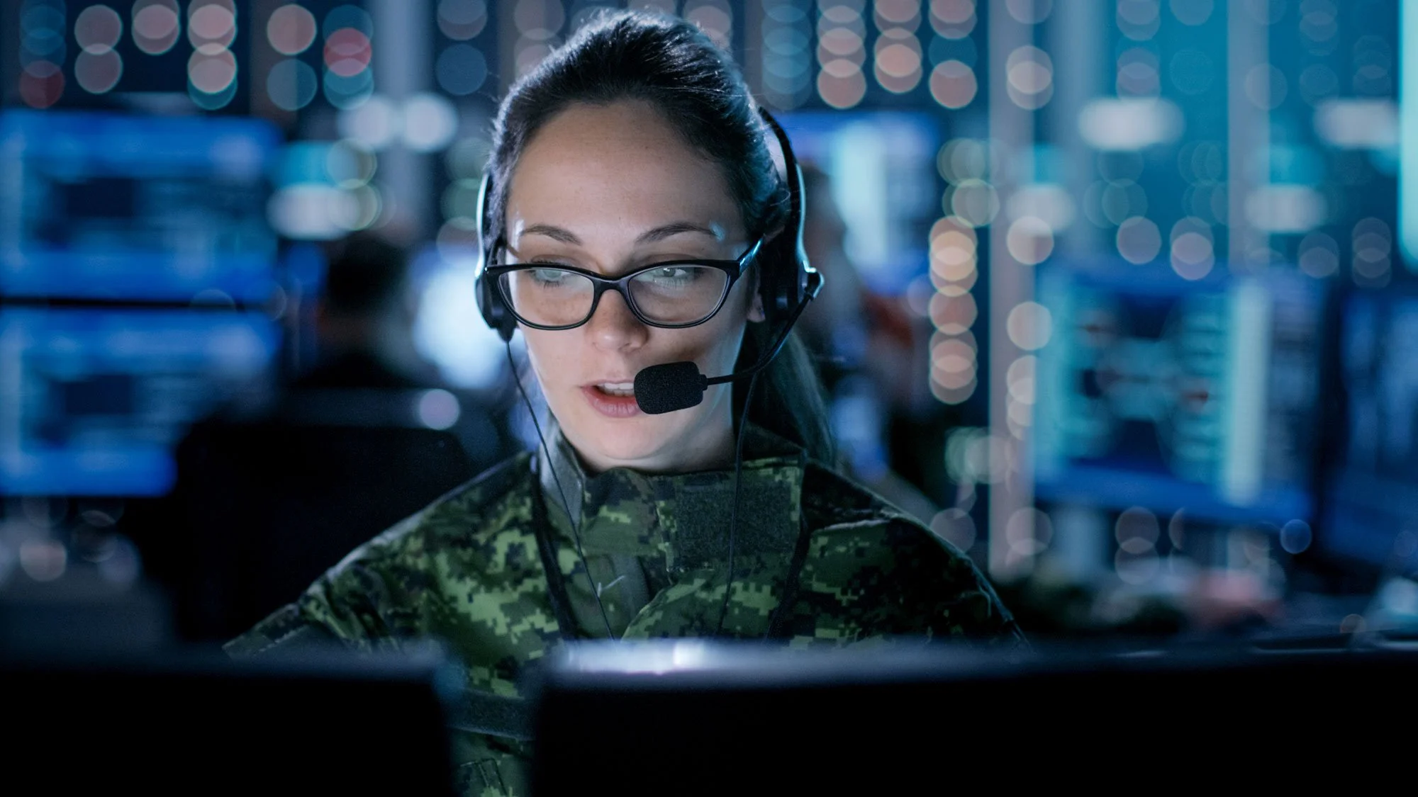 Military woman speaking into headset