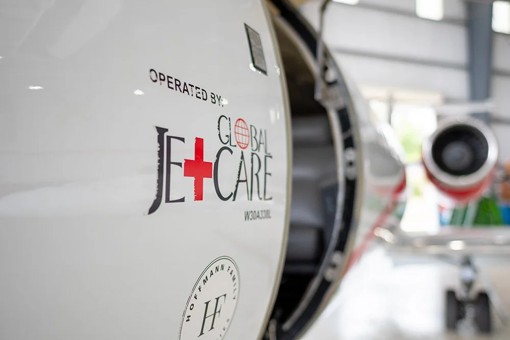 Close-up of an aircraft with the logo and text 'Operated by Global Jet Care' on its side.
