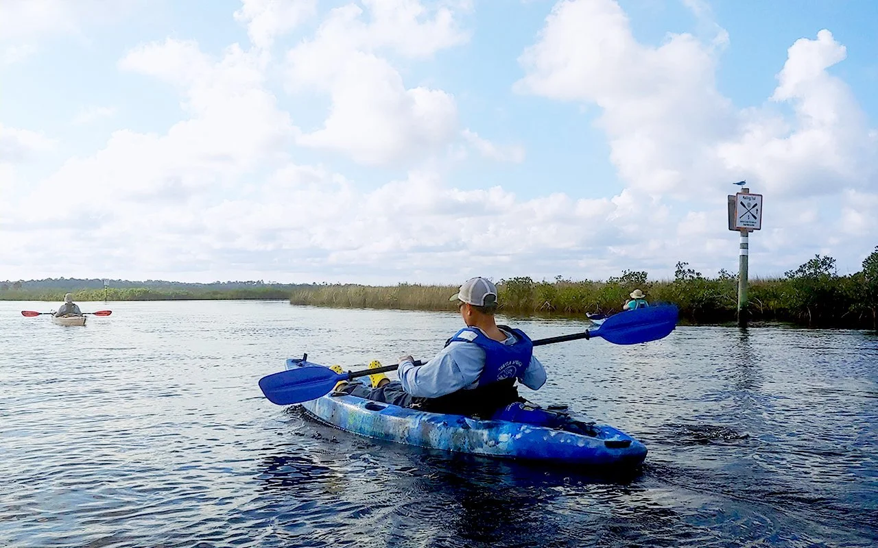 person on paddleboat on lake