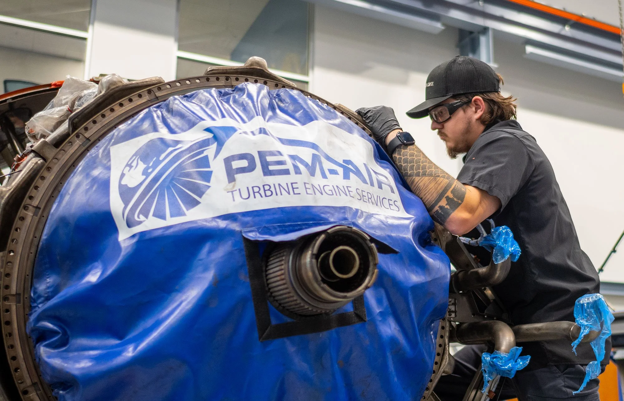 Pem-Air Technician working on engine