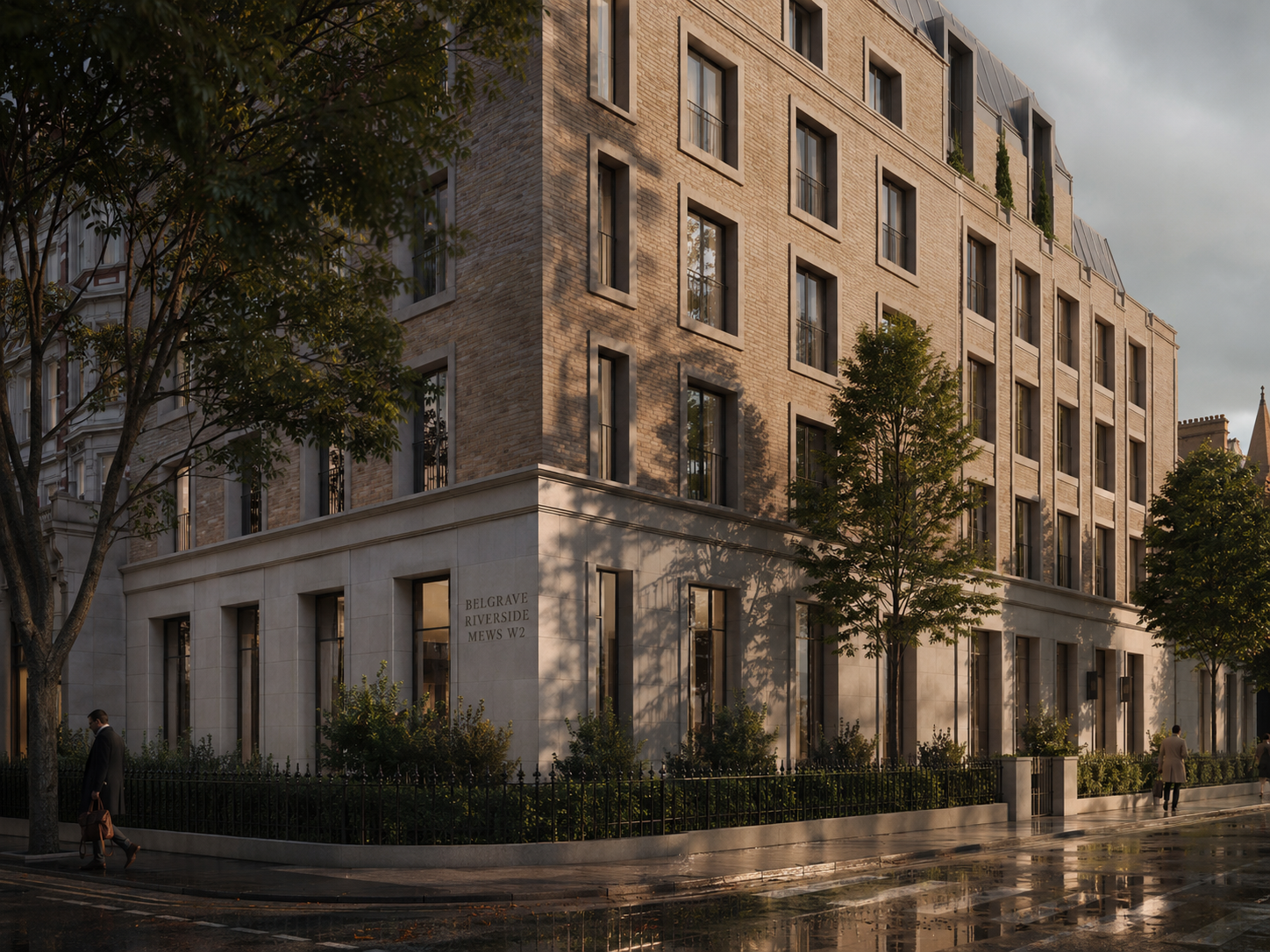 A modern multi-story apartment building with a brick facade and large windows, situated on a city street with trees and pedestrians. The building is labeled Belgrave Riverside Mews W2.