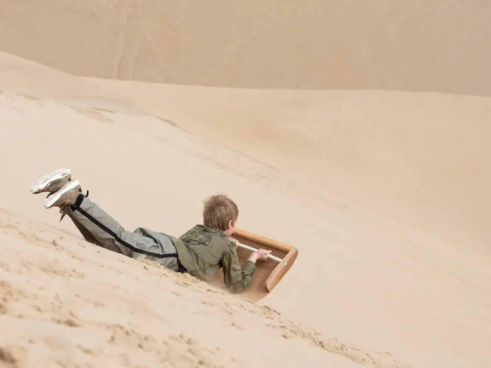namibia-shipwreck-lodge-sand-boarding-2.webp