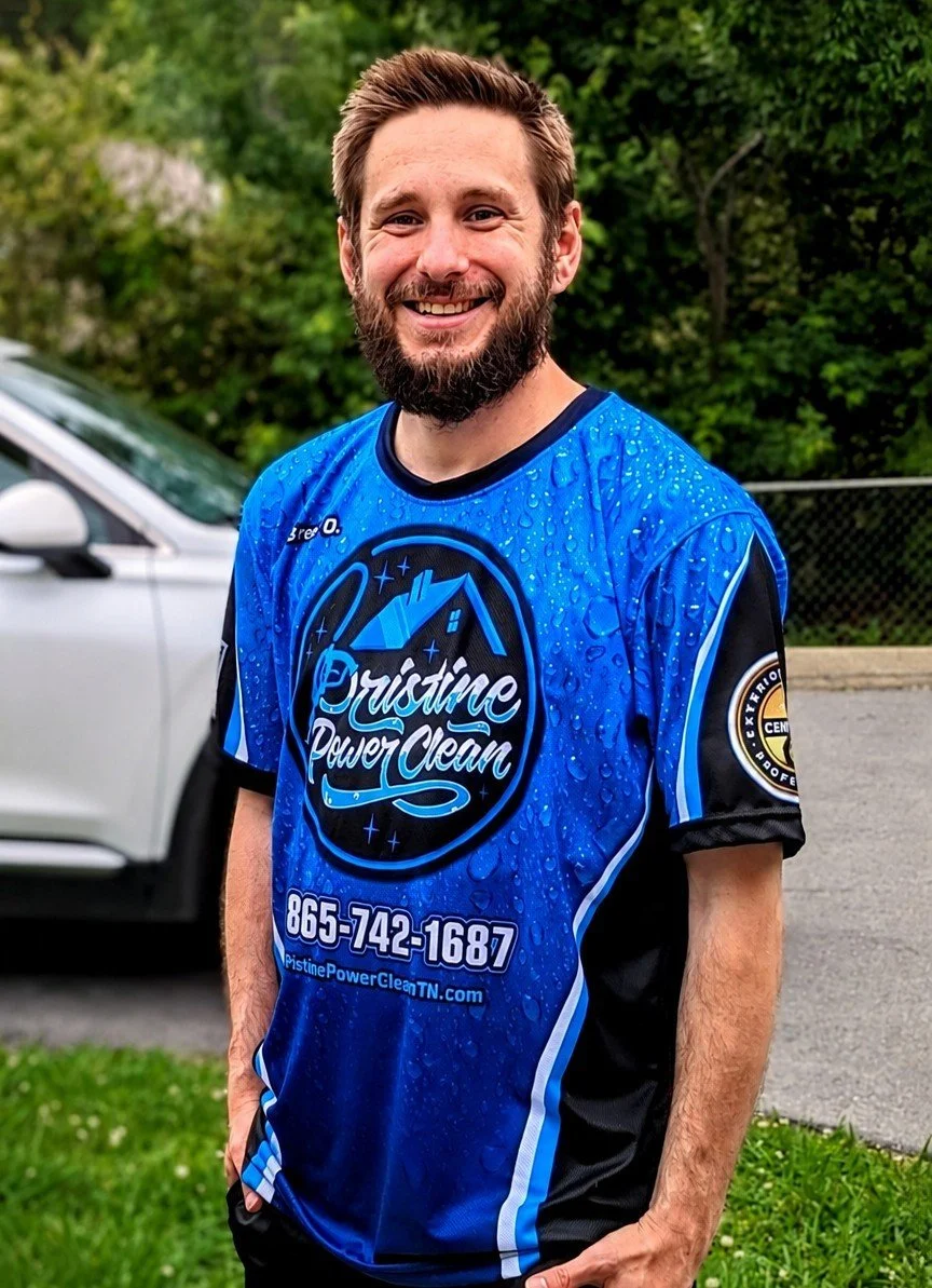 Owner of Pristine Power Clean wearing a branded company shirt at an exterior cleaning job in Knoxville Tennesee