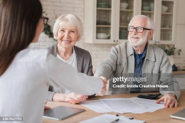 Couple meeting with a Medicare advisor to review their coverage options.