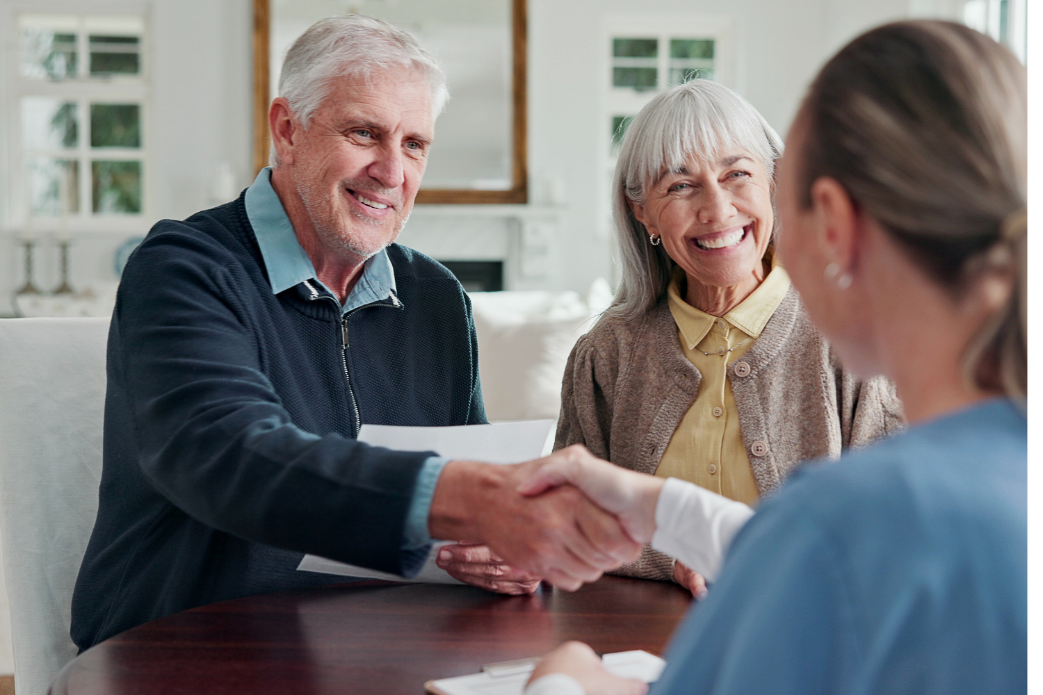 Couple meeting with a Medicare professional to review coverage options.