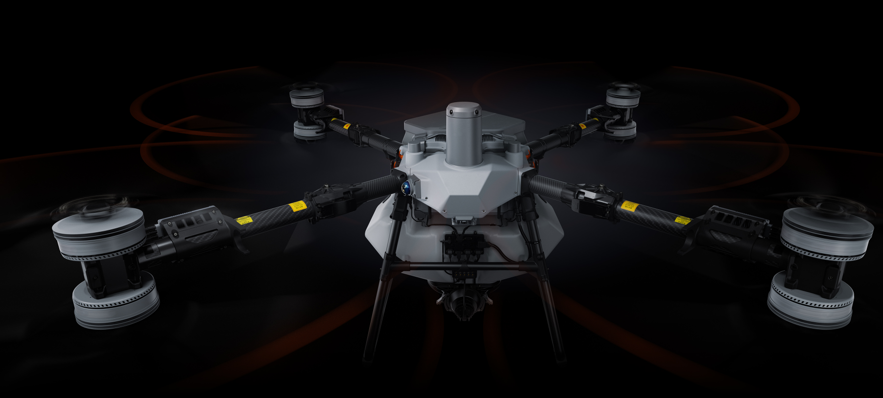 A modern drone with four propellers on a black background, featuring a sleek, angular body and visible wiring and components.