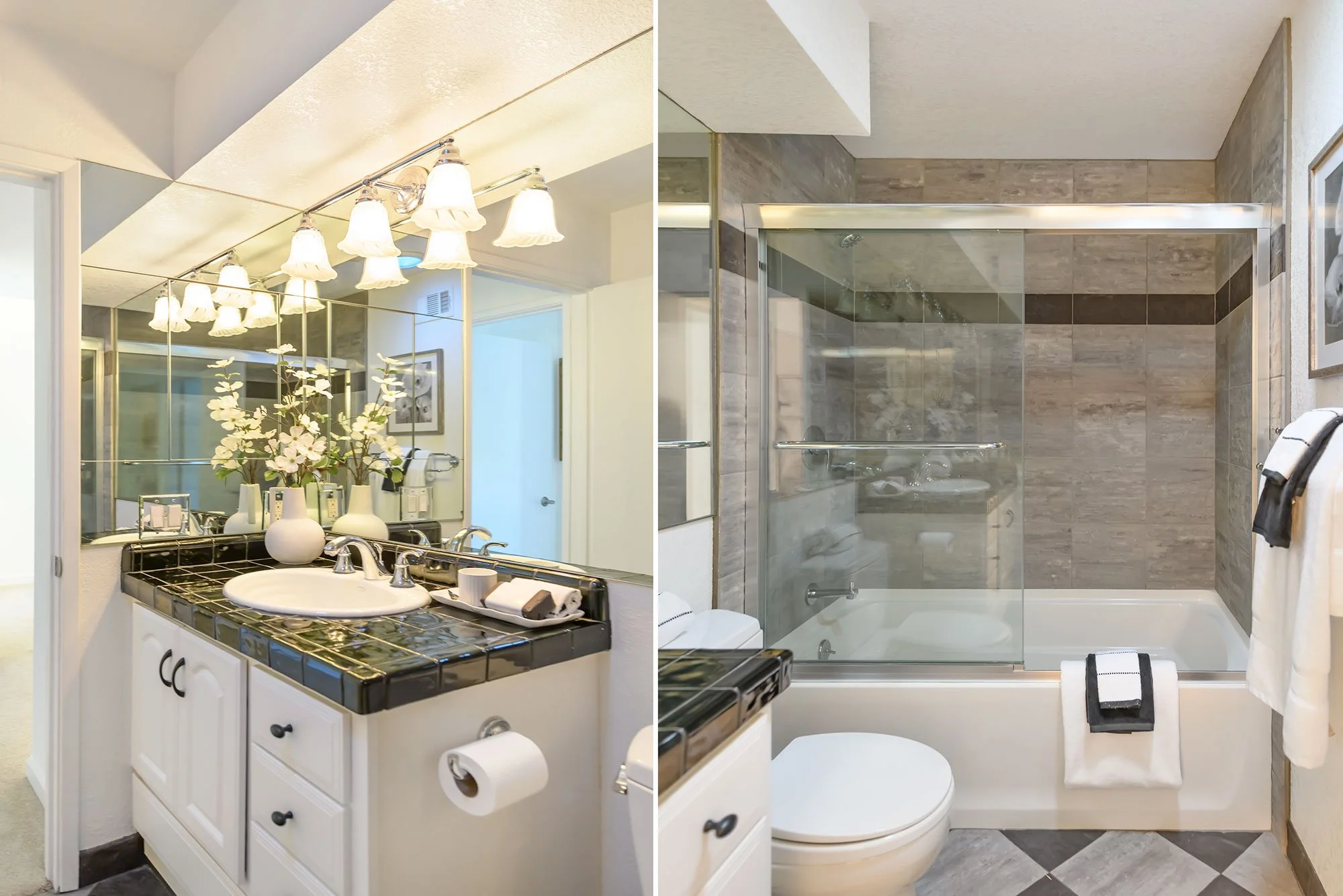 Split image of two bathrooms. The left shows a bathroom vanity with a black countertop, white cabinets, a sink, and a large mirror with decorative lighting. The right shows a bathroom with a tiled shower with a glass door, a toilet, and towels.