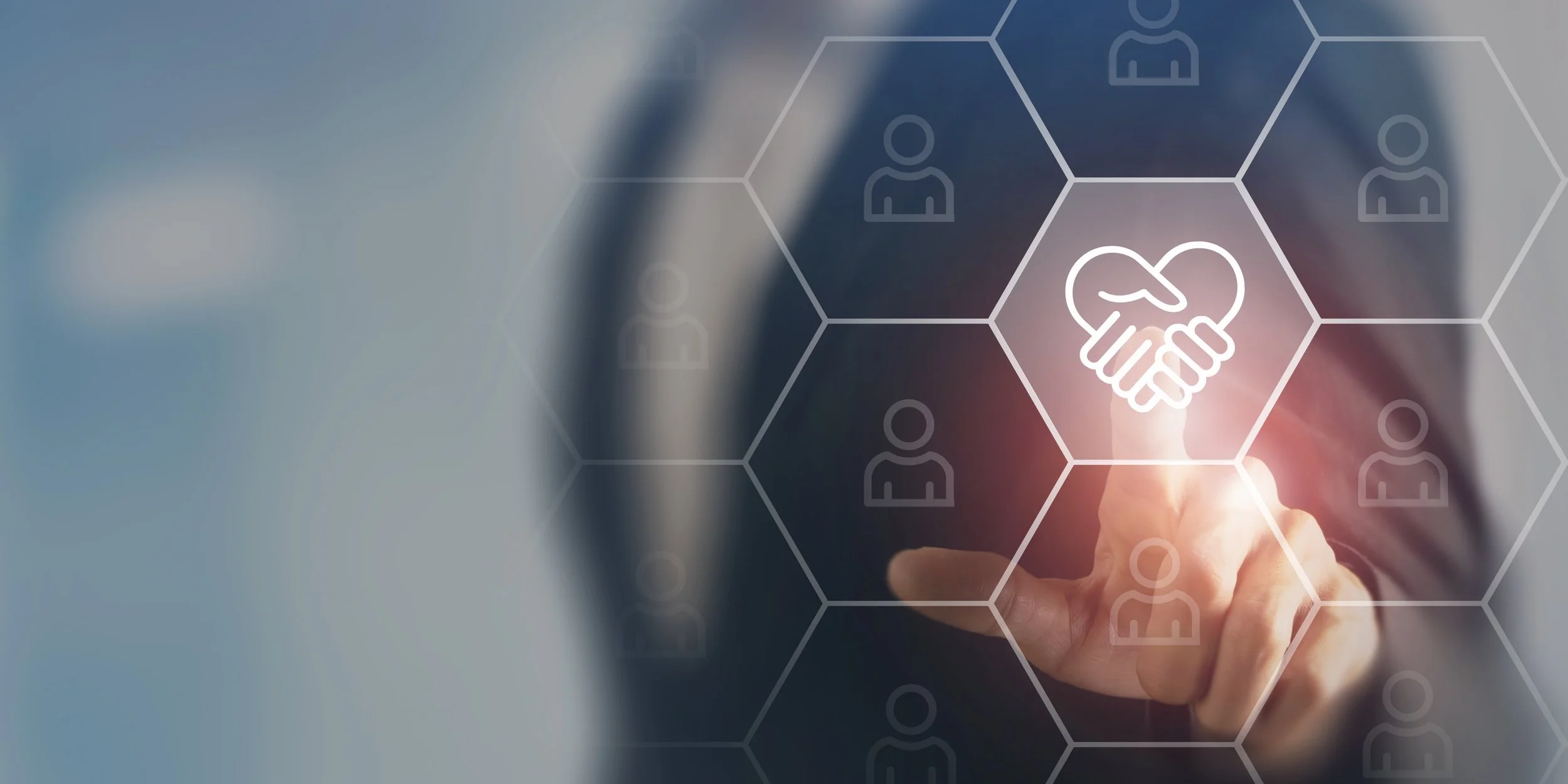 A person touches a digital interface with a handshake icon, surrounded by hexagonal icons of people, representing connection or networking.