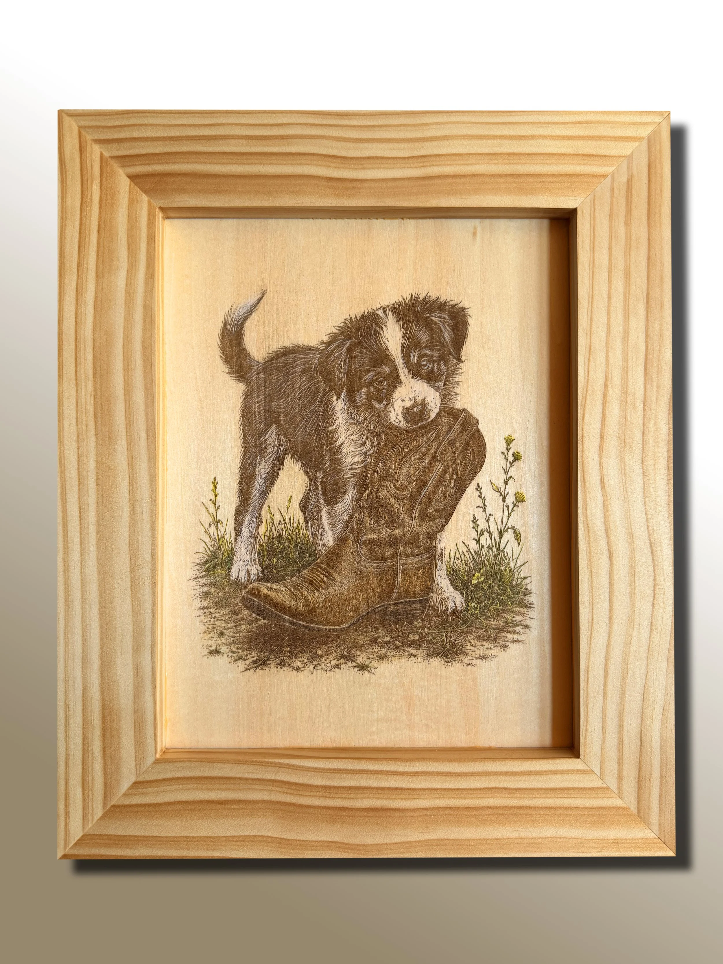 Handcrafted western wall art featuring a playful puppy and cowboy boot. Combines laser engraving and hand-painted oil accents in a rustic wood frame. Perfect for dog lovers, ranch homes, and western décor.