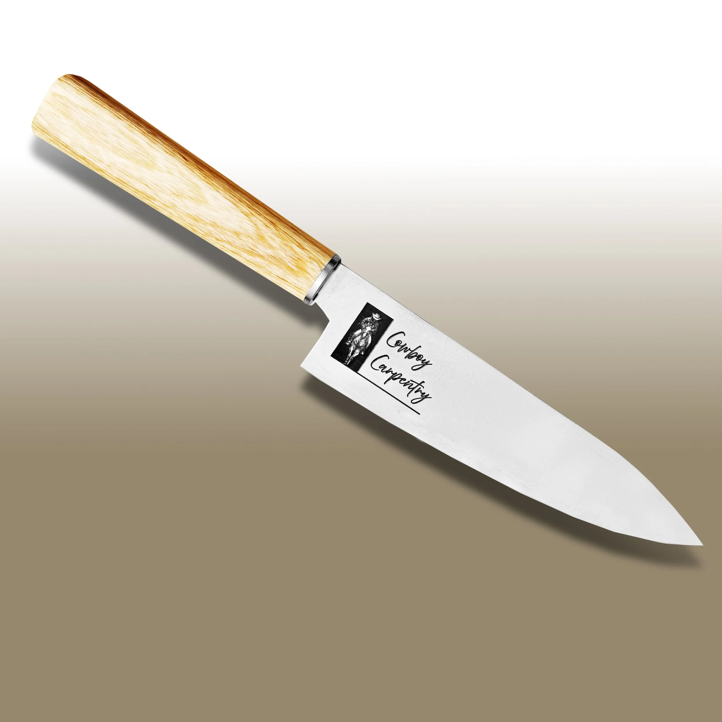 A chef's knife with a wooden handle and a white label that reads 'Company Carpentry' lies on a white and beige surface.