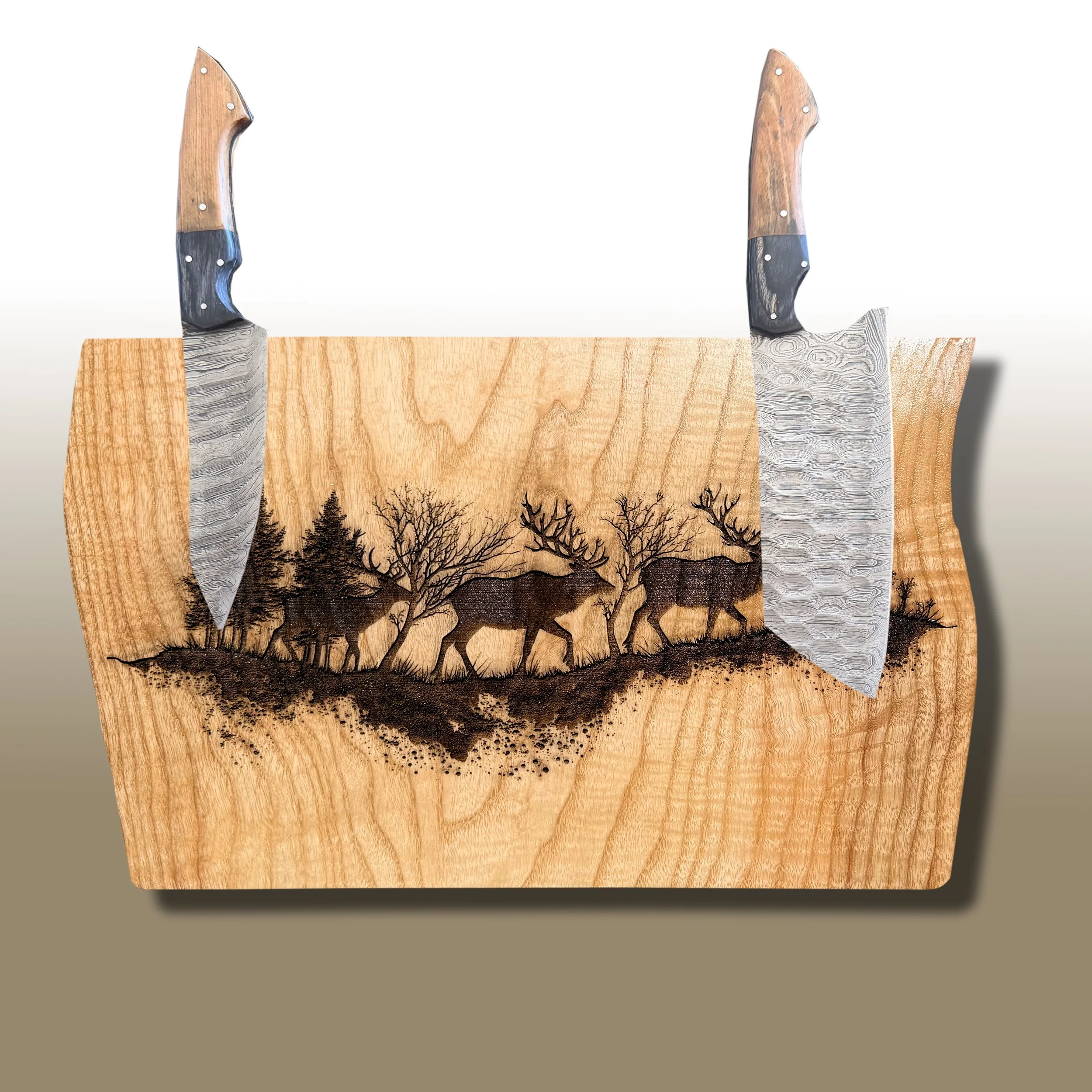 Wooden artist's knife with etched forest scene with trees and animals