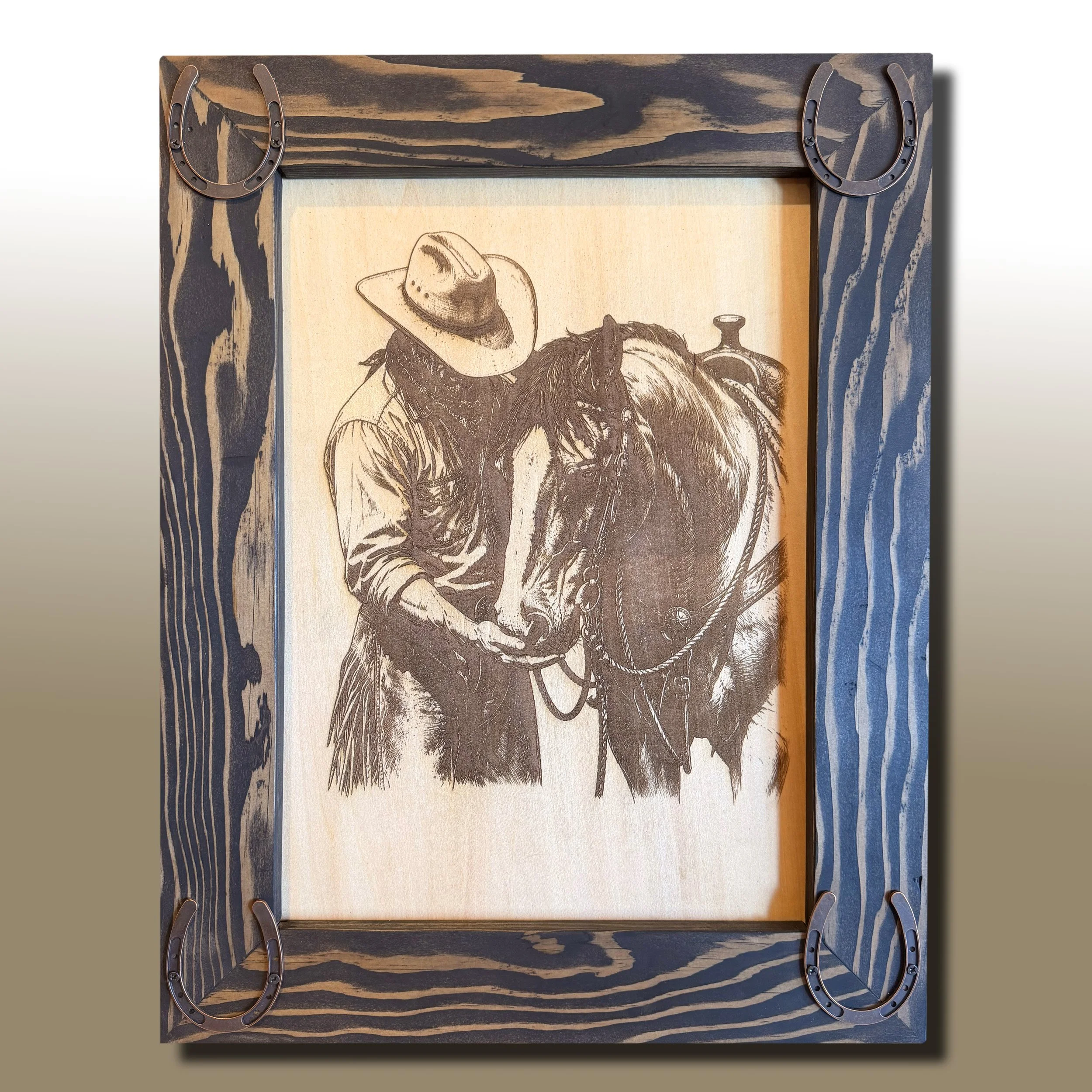 Handcrafted laser engraved cowboy and horse wall art featuring a rustic custom frame with horseshoe accents. Perfect western décor for ranch homes, cabins, horse lovers, and western enthusiasts.