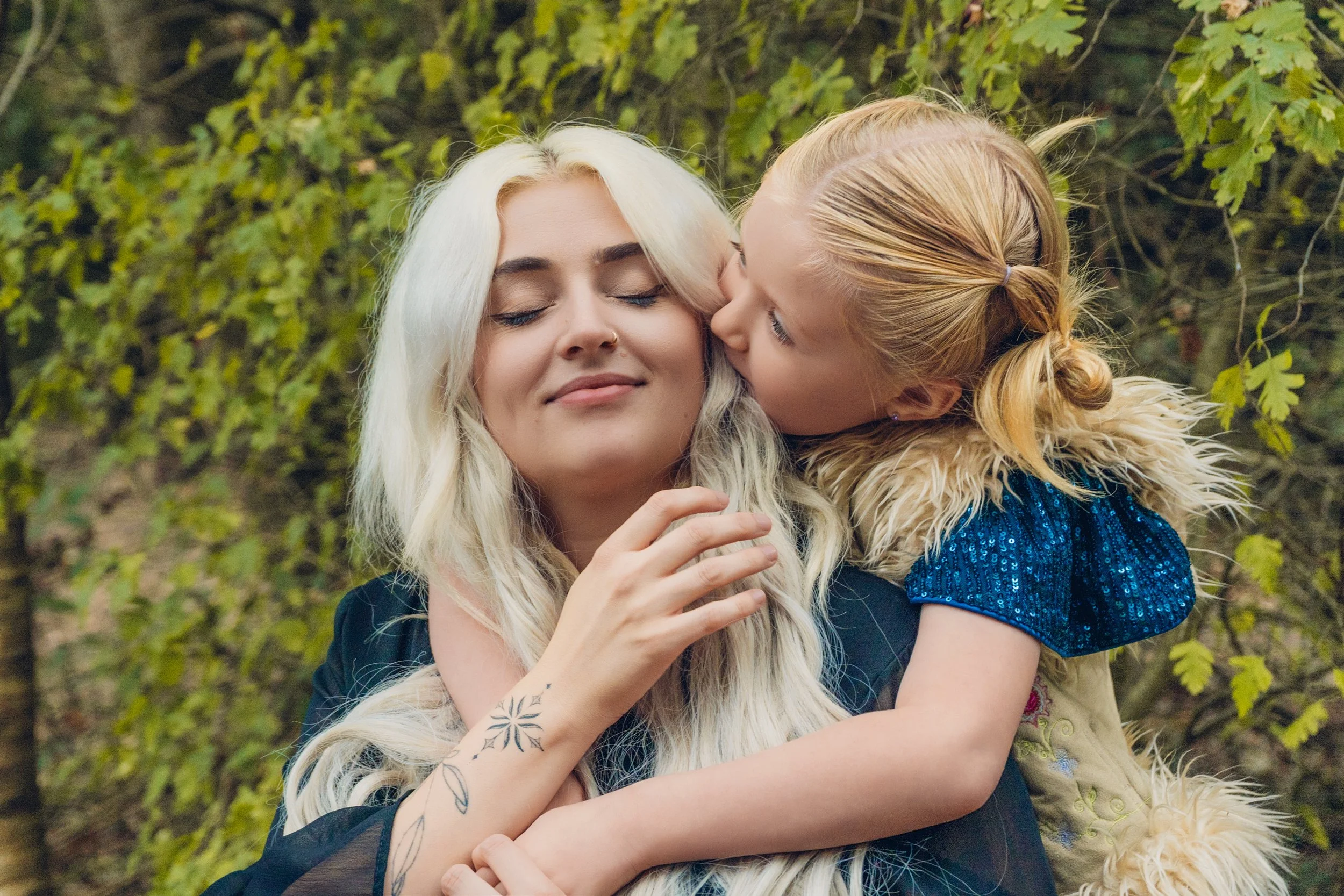 Mum and child hugging during a family portrait session in Woodley