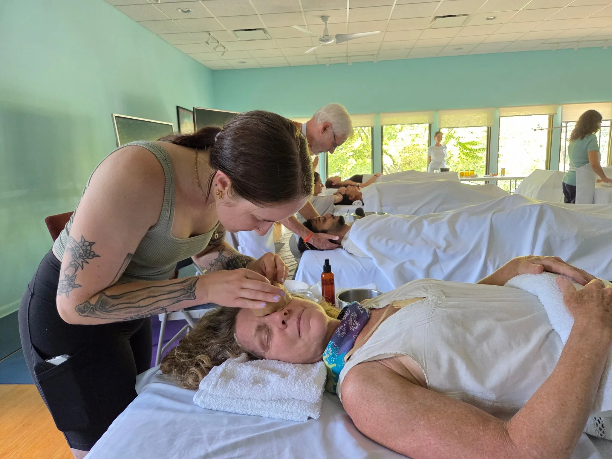 Nadia learning to administer Netra Basti treatments at the Ayurvedic Institute.