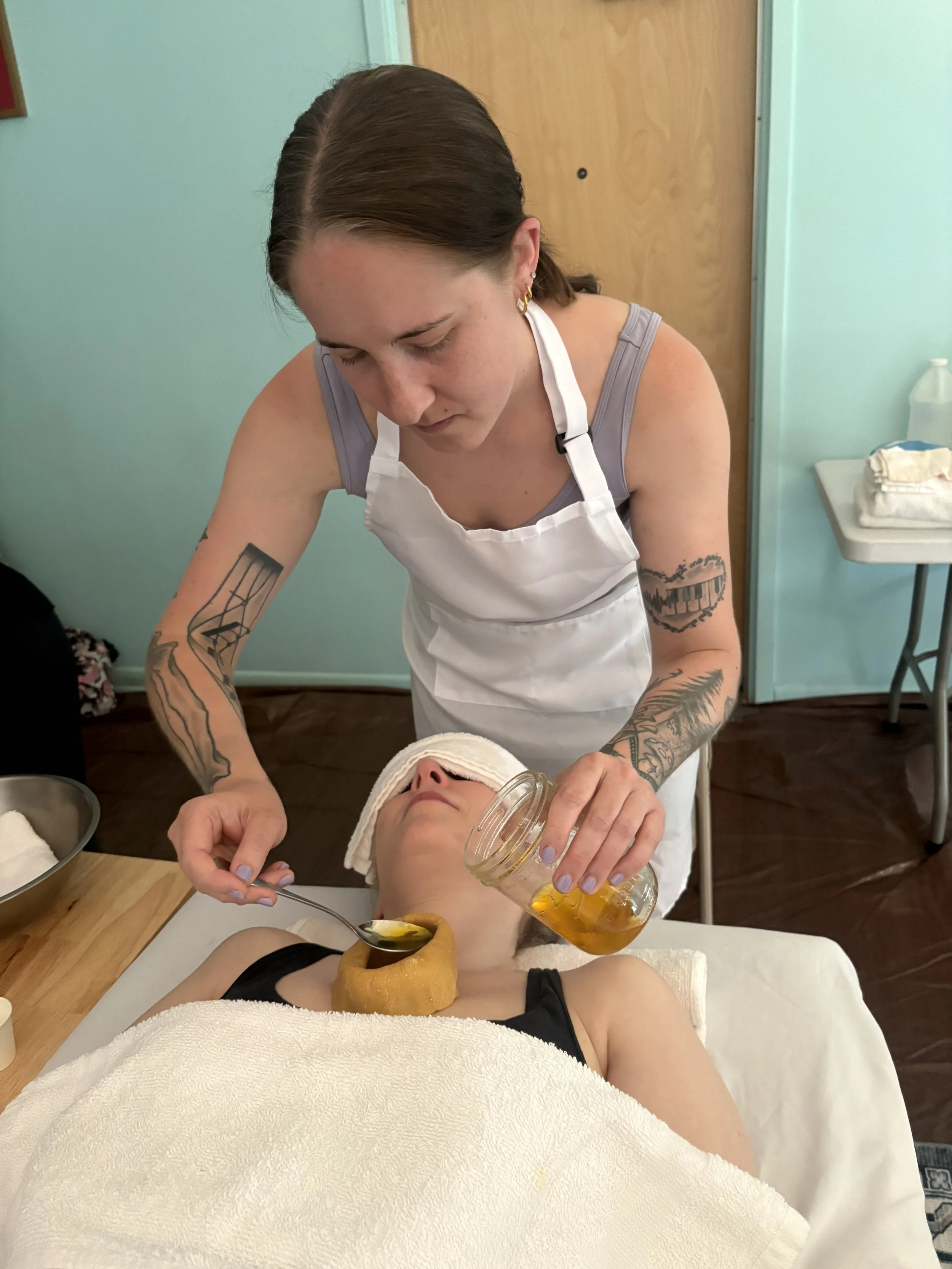 Nadia learning to administer Hrid Basti treatments at the Ayurvedic Institute.