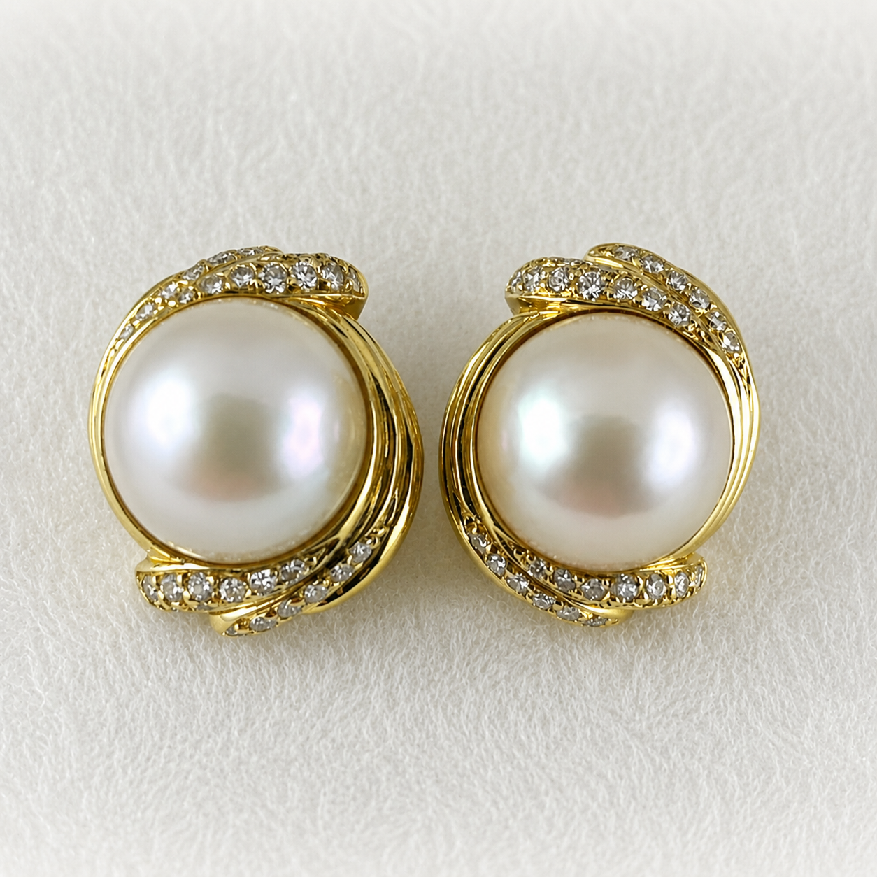 One Pair of Round Mabé Cultured White Pearl and Diamond Button Earrings.