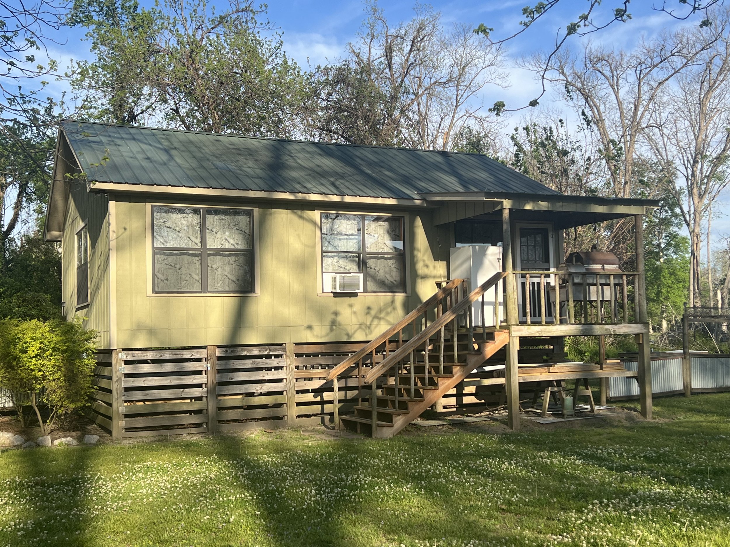 A view of the Catfish Cabin and porch from the driveway.
