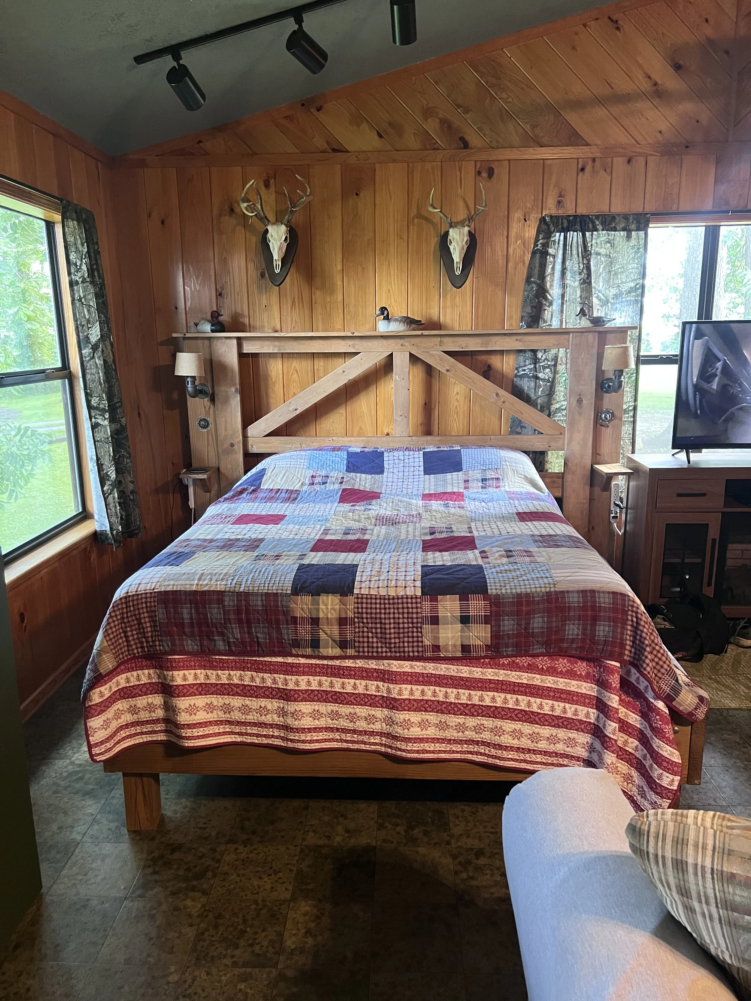 One queen bed in the corner.