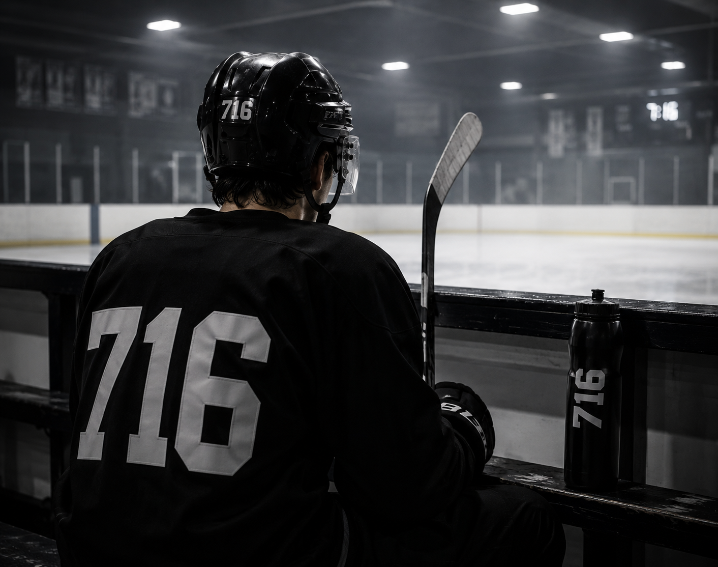 Hockey player on bench during a game.