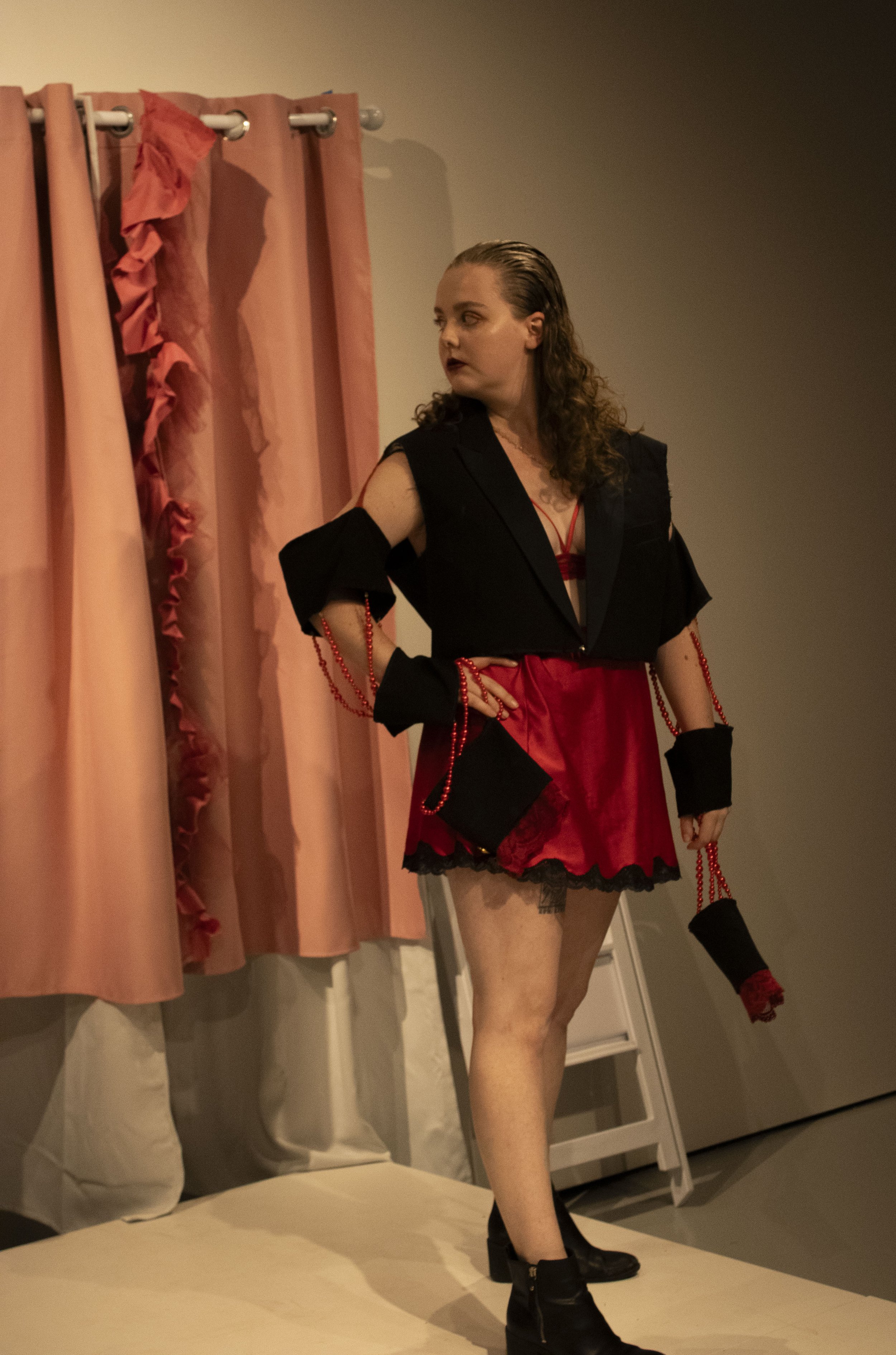 "Corporate Whore (String of Pearls)" by Emma Hunt photo by Theo Hansen