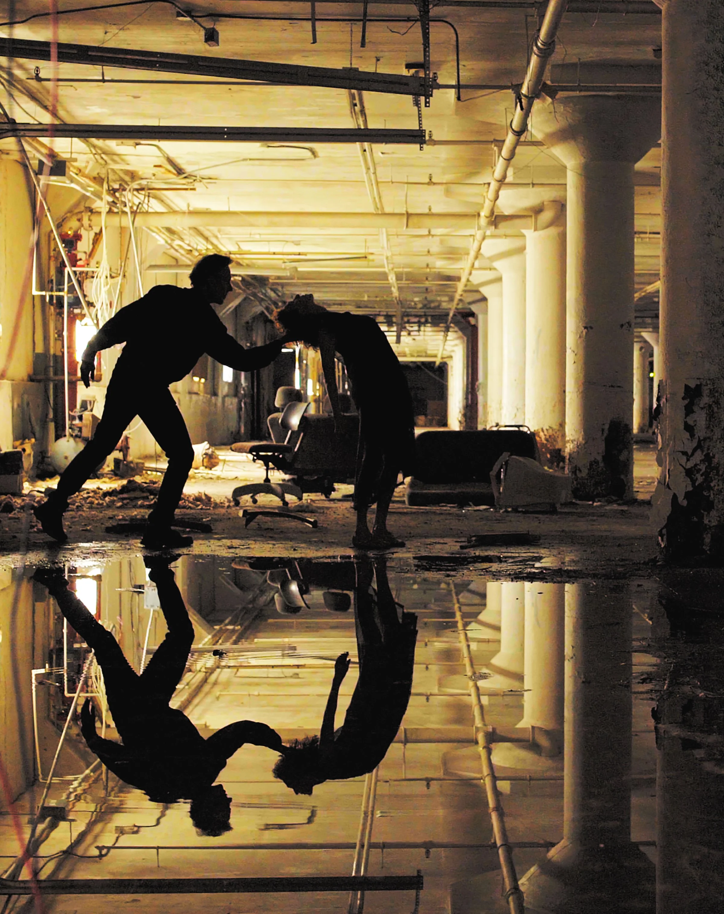 two dancers performing in a factory