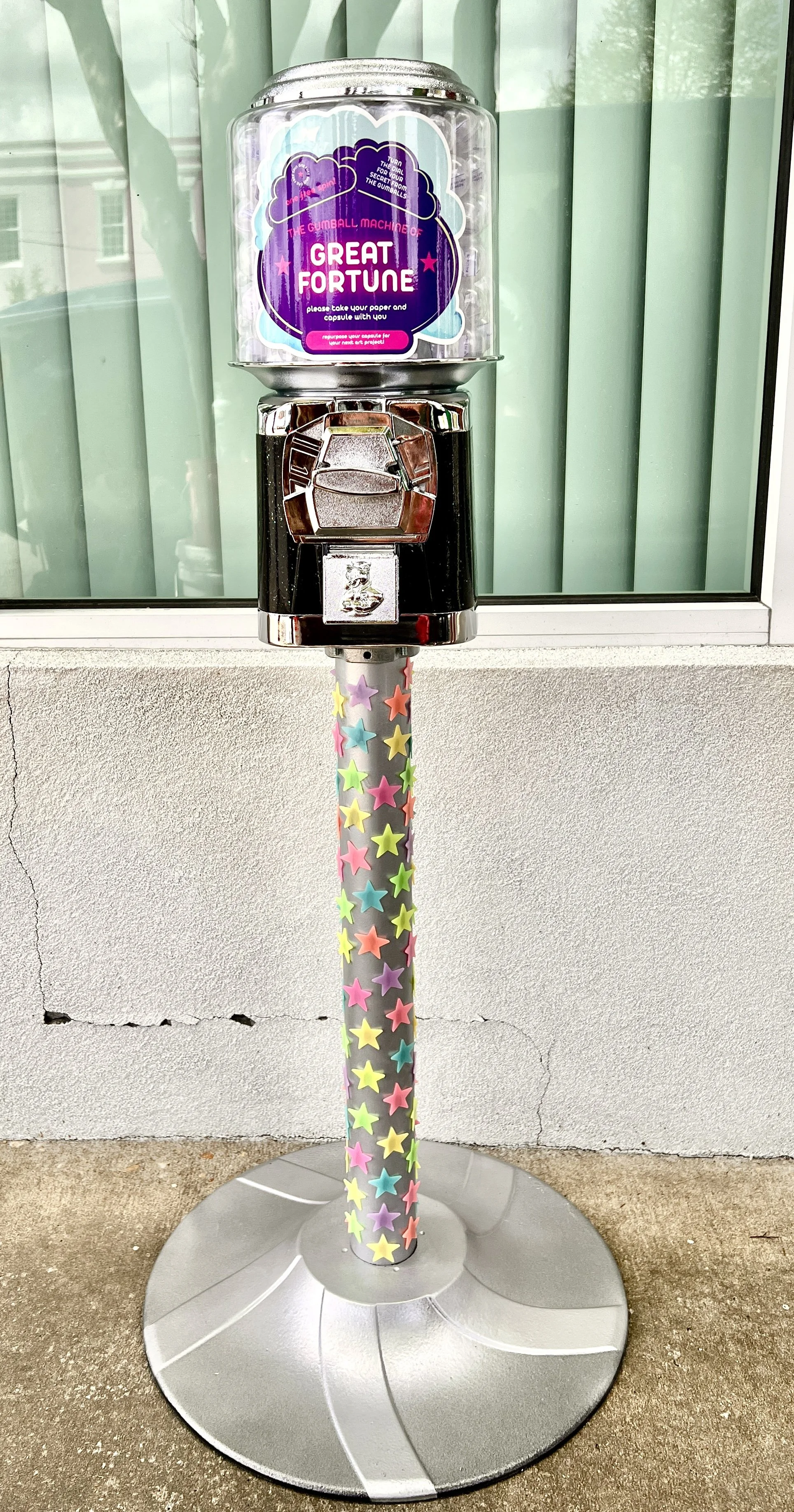 The Gumball Machine of Great Fortune, a public art storytelling object that dispenses mini paper fortunes by artist Bailey Lewis as seen installed on the street for ArtFields SC in Lake City, South Carolina