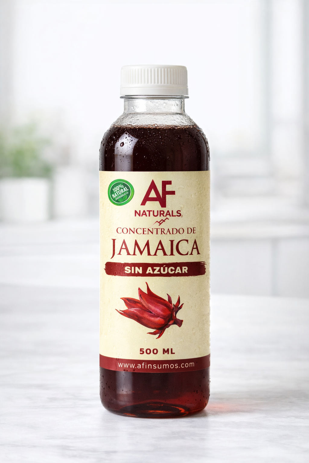 Botella de concentrado de jamaica sin azúcar de 500 ml de la marca AF Naturals, con etiqueta que indica 100% natural y contiene una imagen de flor de jamaica.