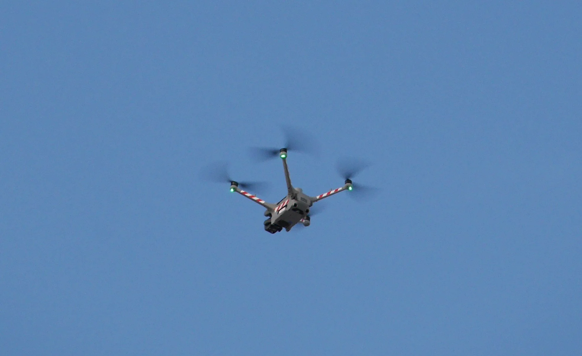 DJI Matrice 4TD enterprise drone in flight performing aerial site documentation and drone mapping services.