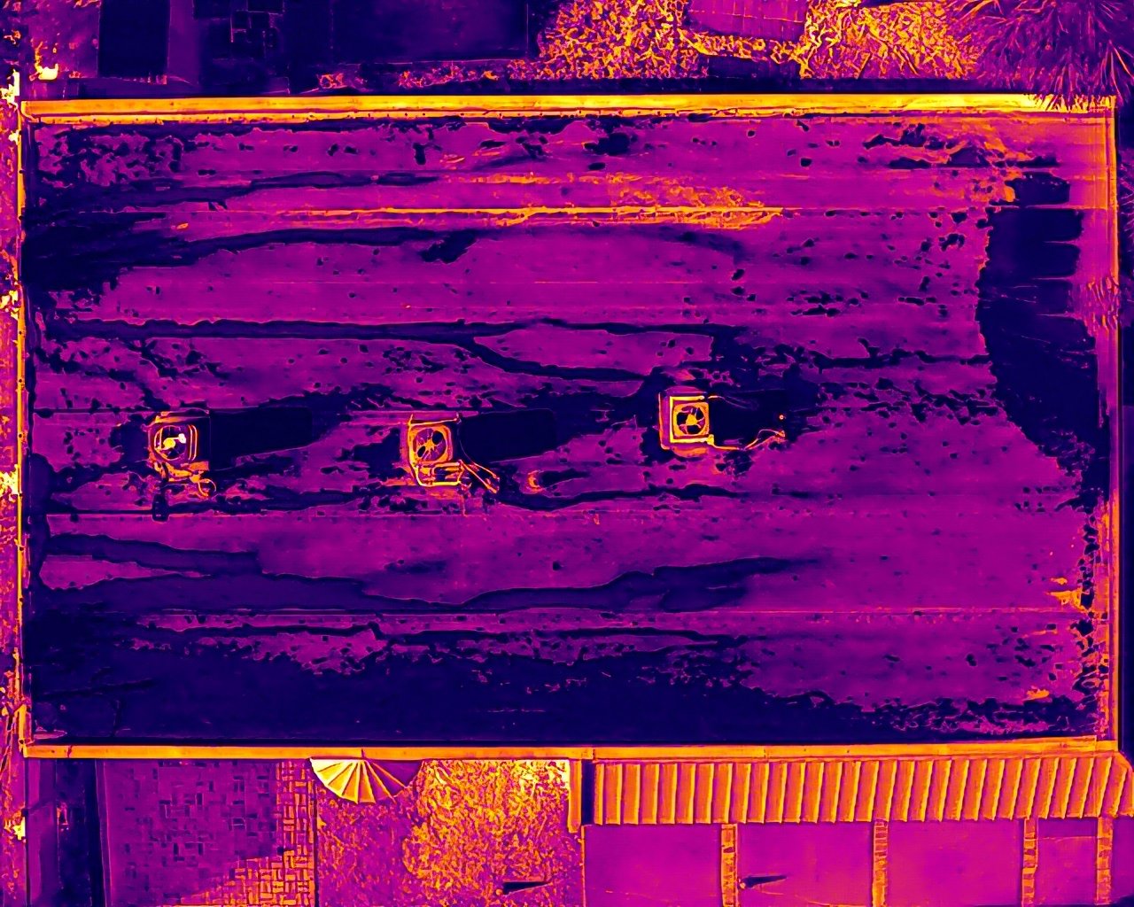 Thermal drone roof inspection showing temperature anomalies on a commercial roof in Tampa, FL - RARI Drones