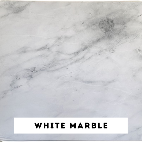 Close-up of white marble surface with gray veining and darker gray spots, labeled "White Marble" at the bottom.