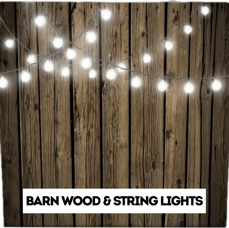 String lights hanging against a wooden barn wall with a sign reading 'Barn Wood & String Lights'.