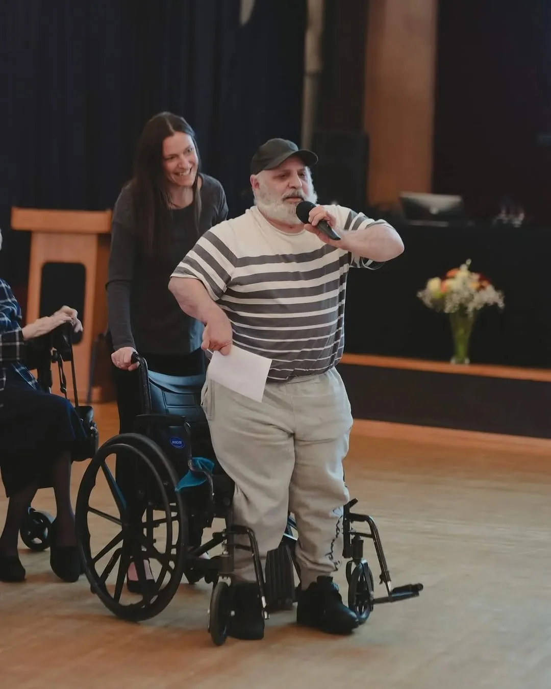 A TangoStride student showing the rewards of being able to stand after have been in classes.
