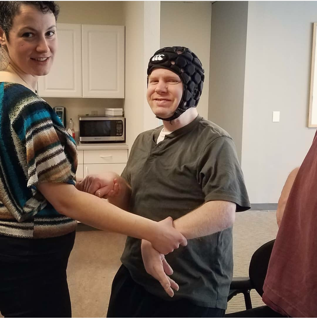 Gabriela helping a long time student of TangoStride