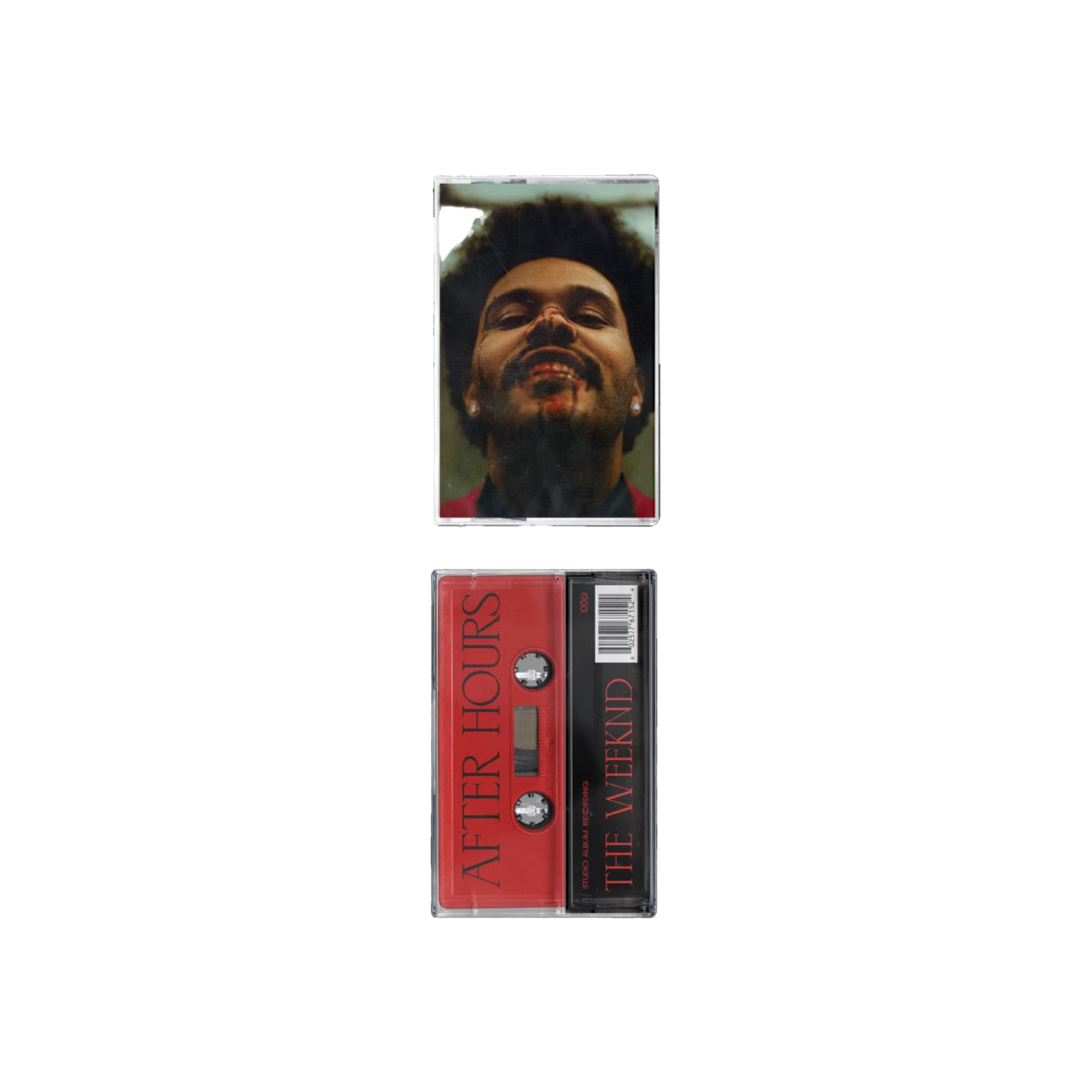 Close-up of a cassette tape with a reflection of a smiling man's face in the case, and a cassette tape below it with red and black design elements.
