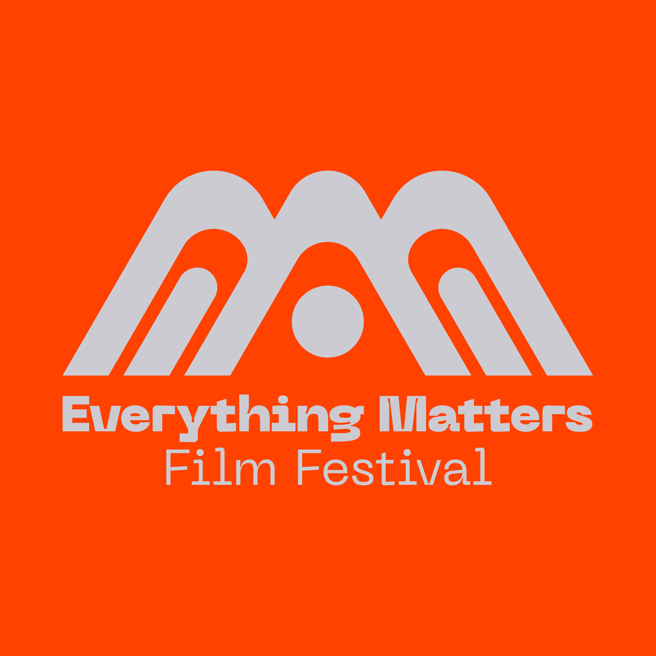 A promotional graphic for a film festival with a bright orange background, a white stylized film reel design, and white text stating 'Everything Matters Film Festival'.