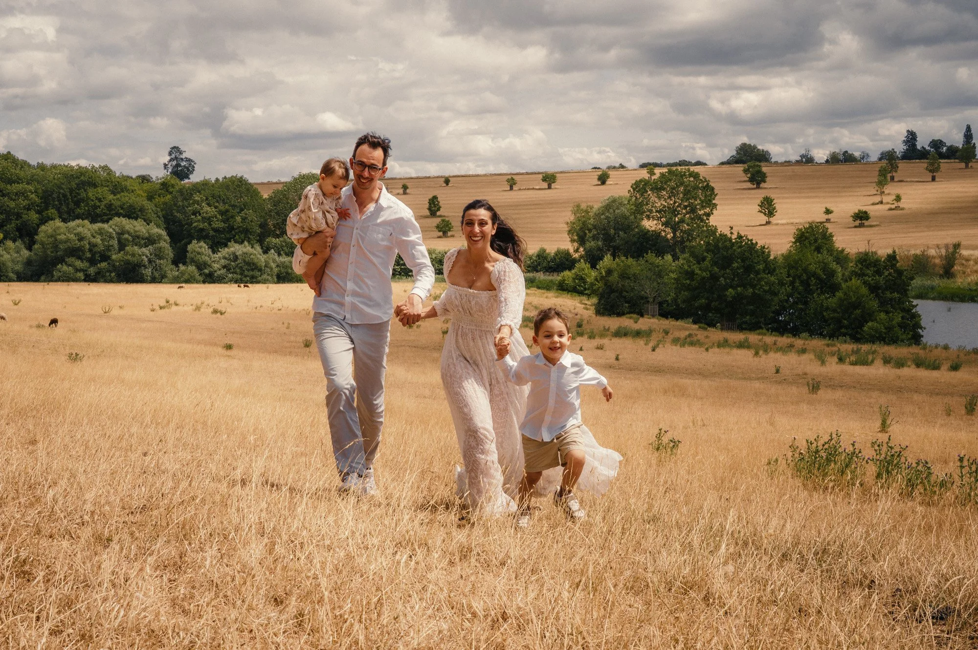 Day time family portrait session in a field by Vervain & Moss Photography, West Warwickshire